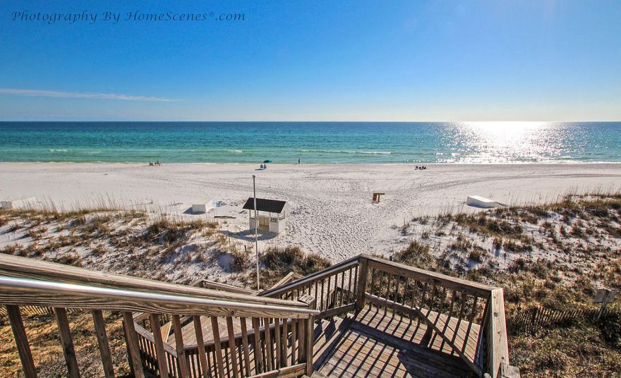 Immaculate 3 Bedroom end unit just steps to the Beach and sparkling water of the Gulf. Offers views of the Gulf from the rear balcony and over looks the pool from the front. Must see unit, sold fully furnished, turn-key and rental ready. As the new owner you can use as a primary home, 2nd home or Income producing property. Rental income projection shows this unit is capable of producing $35,000 a year. Come see this unit, you will not be disappointed..