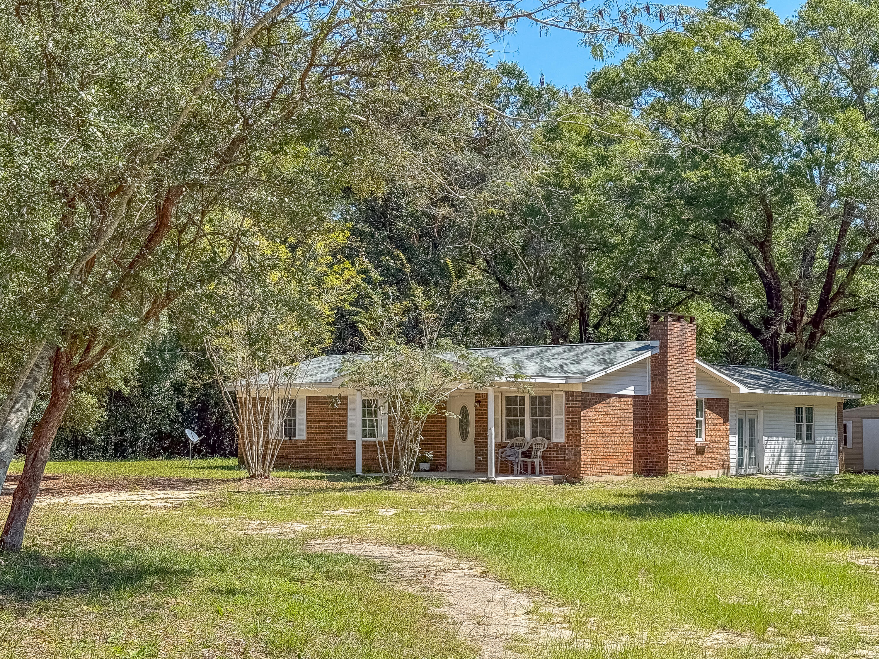 Professional photos coming soon! This 4BR/2BA home will sit on approximately 2 acres and has had all the major updates completed, including a newer roof, HVAC, flooring, electrical, and septic. The roof was replaced in March and the HVAC and electrical wiring in July! The home features a split floor plan, fireplace and a versatile bonus room that can be used as an office, dining area, or flex space. Mature oak trees and azaleas adorn the property giving it that country Florida vibe. There's plenty of room for your horses, chickens, or garden! Located on Old River Road, the property offers the peace and quiet of country living while remaining convenient to Crestview. The landscaping is a blank canvas, and ready for your personal touch. Contact me today to schedule a private showing!