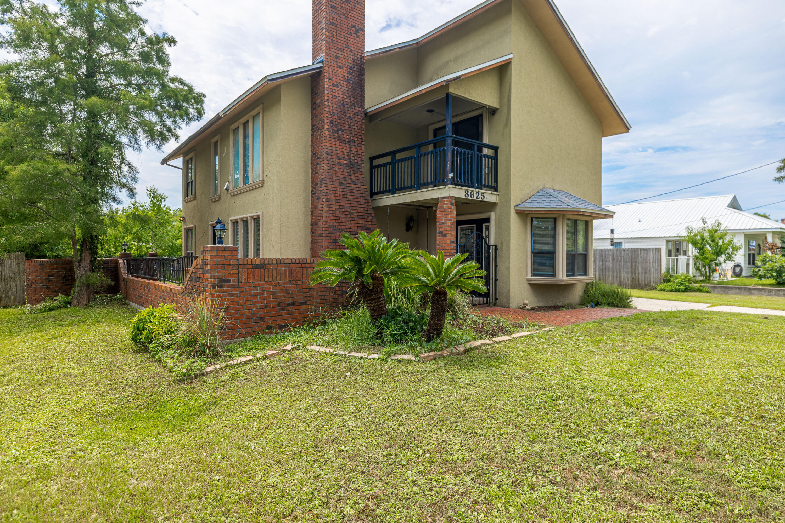 Nestled on a spacious 0.25-acre lot on the desirable east end of Panama City Beach, this unique home is full of character and coastal charm. The large lot offers plenty of room for a private pool! With 3 bedrooms, 3 full bathrooms, and two inviting living areas (one on each floor) there's space for everyone to spread out and enjoy. The oversized master suite offers a private retreat, complete with its own balcony, a large walk-in closet (with laundry hookup!), and a gorgeous en suite bathroom featuring a sleek, standalone soaking tub. Downstairs, you'll find a cozy living room centered around a wood-burning fireplace and a versatile bonus room that's currently used as a 4th bedroom, but perfect for guests, a home office, or creative space. Step outside to a private courtyard (SEE ADD REM. and patio ideal for entertaining, plus a powered workshop for hobbies or extra storage. Located just minutes from the beach, Navy base, shopping, dining, and entertainment, this home offers a rare combination of space, charm, and convenience in one of the area's most sought-after locations.