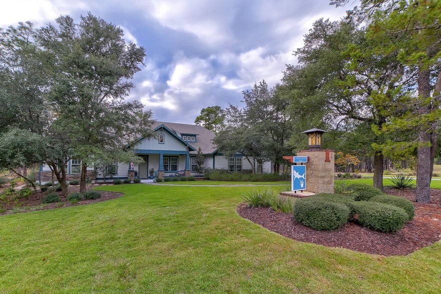 This stunning one of a kind home is located within the lush pristine gated community of Wild Heron. Wild Heron sits on the North side of the largest Coastal Dune Lake, Lake Powell, and is home to the Greg Norman designed Sharks Tooth Golf Course. The waterfront community gym, pool, and boathouse give you spectacular sunsets and even allow you to launch kayaks to the beach or Camp Helen State Park. This home is truly a rare and unique opportunity. Situated on a LARGE lot that backs up to the golf course, this one story custom luxury retreat boast 3,262 sq/ft with four bedrooms and three full baths. As you enter this home you are greeted with a foyer and open dining and living room. The home features a media room, sun room, semi-detached workout and/or office, oversize garage with golf cart parking, over 100 sq/ft finished attic space for even more storage, and large oversized driveway for additional parking. The exterior of the home was recently renovated with new landscaping, smart irrigation system, pavers, gas grill hookup and gas fire pit for you or your family to enjoy the serene nature that surrounds you.  Protected with custom hurricane fabric panels and upgraded gas meter with Generac switch for future gas generator.

This truly custom home is accented with Shaw Nottoway Hickory wood floors throughout with tile in the bathrooms, there are granite counter tops throughout the home and the CUSTOM LUXURY CHEFS KITCHEN is breathtaking with honed granite counter tops, marble back-splash, stainless steel upgraded appliances, gas range, walk in pantry, farm sink, and breakfast area. The master bedroom suite is truly a private oasis with a large bedroom and master bath suite accented with a large walk in shower, double vanity, and large custom California closet. This home leaves nothing to be wanted for and is truly a lifestyle home. Buyer to verify all dimensions.