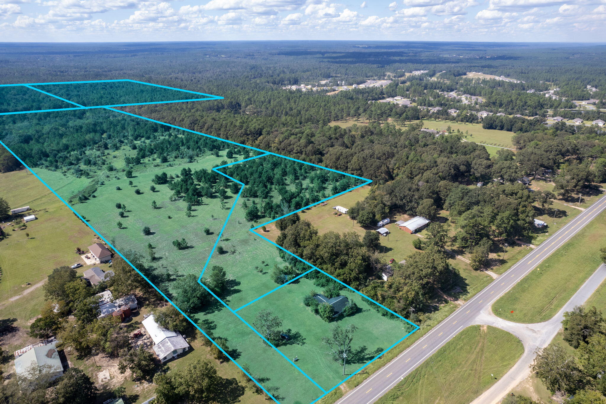 120+/- Acres! Multiple parcels must sell together. Approximately 275 feet of Hwy 85 road frontage.  Currently zoned Rural Residential two homes per acre. Home holds no value. Utilities available water and power. Property has adjoining acreage to Heritage Plantation. Buyer to verify all dimensions. Flood Zone X. This parcel is a blank canvas~ if you are developing affordable housing this parcel is eligible for additional density based on the 'Live Local Act 'requirements