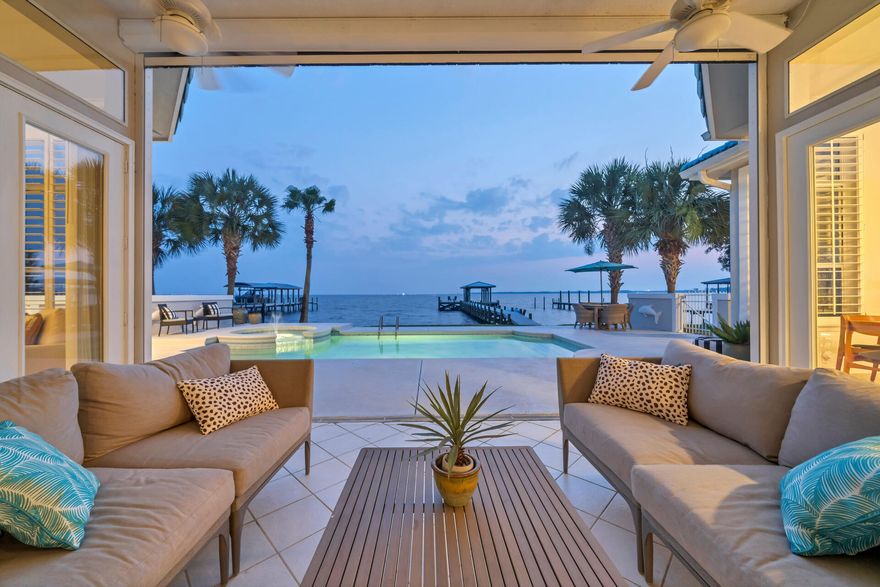 RARE WATERFRONT OPPORTUNITY!! Welcome Home to 1335 Windward Circle, the most sought-after street in Niceville and where you'll find the ultimate sunset views on Choctawhatchee Bay. Spacious one level Living; 4 bedrooms, 2 ½ half baths, 3 car garage. Open & inviting with 11' ceilings, two spacious living areas, expansive slider doors that perfectly frame the picturesque views of the pool & the Bay. The Gourmet kitchen is stunning with white quartz countertops, brushed gold hardware, Sub Zero Refrigerator, 6 burner gas range w/oven!  A charming breakfast nook beckons with additional sliding glass doors that lead to the open Florida room which provides a seamless transition to the pool, hot tub and Bayfront Lifestyle! Your Primary Suite is expansive, complete with a cozy sitting area and ensuite primary bathroom with double vanity, quartz countertops, a spacious walk-in shower, a luxurious jacuzzi tub and two generous closets.  There are 2 Guest Bedrooms on the opposite side of the home with guest bath & laundry; along with a 4th bedroom, currently being used as an office. Exterior highlights of this remarkable property include a sprinkler system, an outdoor shower, a pool and hot tub. The oversized three-car garage with crescent paver driveway provides ample maneuvering room for multiple vehicles. Enjoy the Brand-New Boat Dock with 32' boathouse with ThruFlow" composite decking, 8000lb boat lift, swim platform, piling wrap, hurricane braces, lighting and plumbing with 2 hose reels fore and aft for cleaning your boat. The enhanced design allows easy access for paddleboarding, kayaking, and even dolphin watching.  The large patio has recently been fitted with a hurricane-rated power roll down screen. Windward offers a central brick paver gathering park, a 100-foot sandy beach park with a boat dock, and exclusive zero-entry access to the bay for swimming, reserved solely for homeowners and their guests. Bluewater Bay, a meticulously planned community, offers an array of amenities including scenic lakes, parks, sports fields, four swimming pools, a bayside marina, pickleball and tennis courts. This property truly embodies the essence of community living and waterfront lifestyle, making it an absolute must-see for discerning buyers.