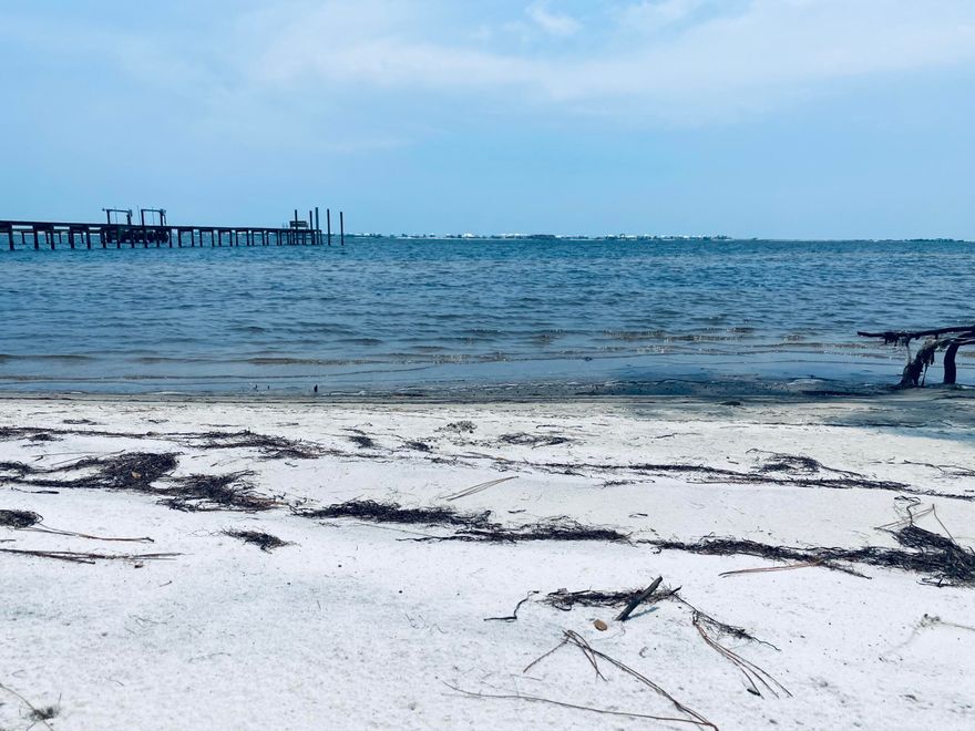 Remarkable dry and cleared beach lot property on the sound side. Build your dream home here with a provided new survey and wetland study. The lot is cleared so you can walk through at your leisure to see your vision here on Mulberry Lane. The county has approved the recent floor plans that was chosen but you can decide on the right fit for your family during the contract stage. Must go through the proper steps of the HOA for final approval. This lot is situated in one of the most desirable areas of Navarre. Build your dock and boat lift just like the neighbors so you can go out fishing, kayaking, watching dolphins and so much more. At night you will see a well lit up beach across the way with all the condos and homes on Navarre beach. The water will glisten and sparkle at night.