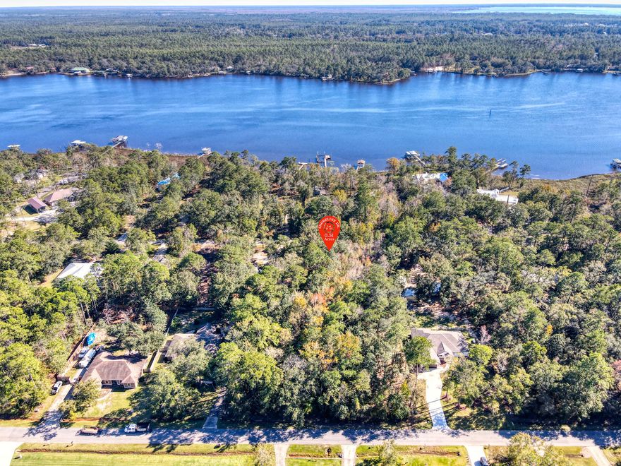 This beautiful subdivision offers the luxury of privacy and it is surrounded by scenic Bay water view and mature oak trees and no HOA fees.

This unique property is approximately half of an acre of Raw Land with ''No utilities in place'' but public water and sewer are available in the area. 

Close access to nearby cities and towns (Close by popular cities: Destin Florida, 30A / Seaside and Panama City Beach) Daily errands and major services are located within 5-8 miles. Close distance to shopping centers, hospital, gulf courses, great food and our sugary sand beaches of the Emerald Coast.
Locals can also take advantage of the excellent fishing lakes in the surrounding area, and there are ample opportunities for outdoor activities like golfing, hiking, hunting, and boating. 78% of wetland present. Wetland study available by request over email.