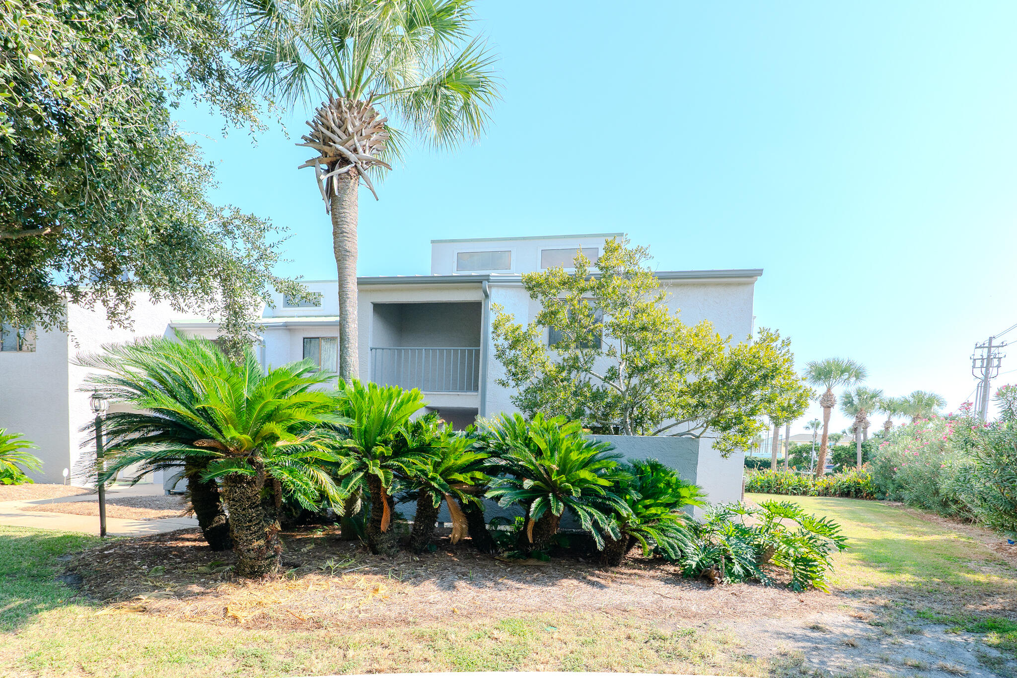 Private End Unit! New appliances and LVP flooring! Nestled in gated community on exclusive Holiday Isle. Pristine, floral garden themed community has only 30 units, so you won't feel crowded. To give you more of that exclusive beach vibe, you'll have well-maintained, private beach walkways leading out to the sugar while sand and beautiful Gulf waters.Features a pool, tennis courts, & club house/fitness center. Unit boasts 2 large, private patios (front & back!) on first floor. 2nd floor features a small Florida room off master bedroom you can enjoy a variety of ways. & private, covered balcony off guest bedroom. Located in the heart of Destin, you'll be in close proximity to shopping, famous local restaurants, & Destin Harbor. Perfect for full time residence, second, home, or investment.