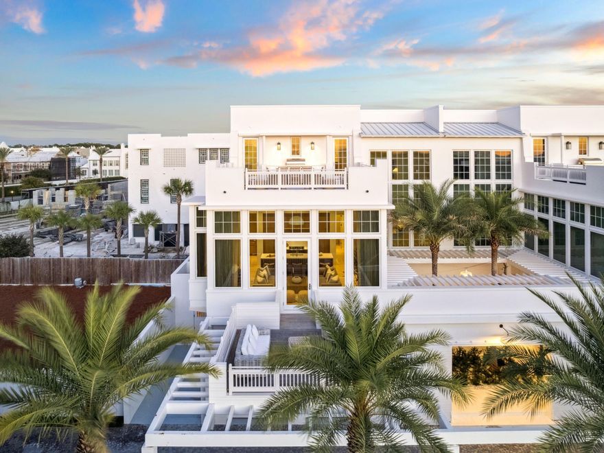 Positioned along the coveted south side of 30A, this furnished Kaiya villa showcases sweeping Gulf views from multiple levels and sits on one of only twelve homesites granted this premier location. Thoughtfully designed across three stories, it blends modern coastal architecture with a calm, indoor-outdoor flow.A private entry courtyard opens to a gracious foyer with elevator access to all floors. The first level features two beautifully finished guest suites, each with an ensuite bath, along with a two-car garage for ease and security. The second level serves as the main gathering space, defined by soaring ceilings, curated designer finishes, and walls of glass that frame sweeping Gulf vistas. The chef's kitchen offers custom cabinetry, premium appliances, and a refined island that flows into the dining area and covered terrace. A tranquil bedroom suite with a spa-inspired bath and its own private outdoor retreat completes this floor.

The top level is designed for elevated coastal living, highlighted by a stunning rooftop terrace with panoramic Gulf views and a summer kitchen ideal for open-air dining. A second luxurious suite anchors this level, featuring a private balcony, an elegant ensuite bath, and a generous dressing area, complemented by a media lounge.

With its exclusive south-side positioning, compelling views, and fully furnished presentation, this Kaiya villa stands among the most impressive offerings along 30A.