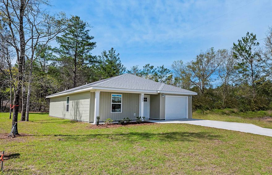 THIS IS AN AWSOME HOME!!! HIGH END FINISHES AT AN AFFORDABLE PRICE!!! The first thing you notice when walking in is how the interior designer has the colors flowing. YES, an interior designer is involved.  As you move in to the  main living area the home really explodes with grandeur.  Featuring an open living space with kitchen island, custom granite counter tops, tile backsplash AND an under mount stainless steel sink!!! The rest of the home does not disappoint either. The large master bedroom with walk in closet in the master bath as well as custom granite in both bath rooms. Come see this home today. There is also an attached additional 1/2 acre available at an affortable price.