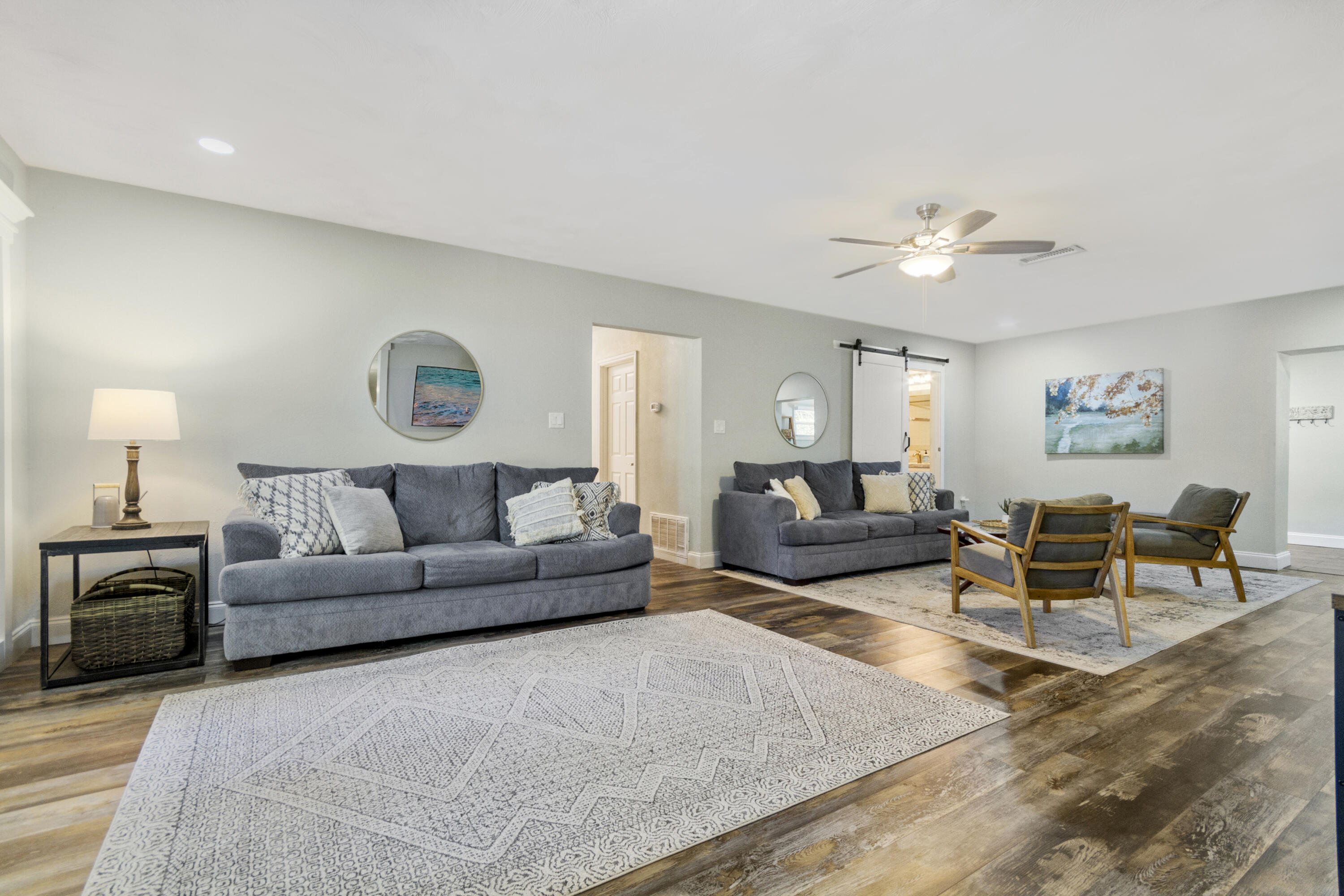 Back on the Market with another Price Drop to $640K improvement allowance. This property is a rare find in the heart of Fort Walton Beach, offering the perfect blend of space, comfort, and potential. The main level of this recently renovated rambler features four generously sized bedrooms, including two luxurious master suites with private en-suite baths, ensuring plenty of room for family and guests. The two additional bedrooms share a well-appointed full bath, providing convenience and comfort for everyone. The kitchen is a true chef's delight, boasting extensive cabinetry, abundant countertop workspace, and a massive pantry that can accommodate all your culinary needs. The adjacent dining area is both spacious and inviting, centered around a charming wood-burning fireplace. The adjacent dining area is both spacious and inviting, centered around a charming wood-burning fireplace that adds warmth and ambiance to every meal. The living room is expansive, providing ample space for gatherings, movie nights, or simply unwinding after a long day. Step outside to the covered back porch, where you can enjoy your morning coffee or evening drinks while taking in the serene surroundings. The oversized laundry area offers flexibility, with the potential to serve as a kids' playroom, home office, or whatever your heart desires. The property's standout feature is the separate mother-in-law apartment located in the basement. This self-contained living space includes an open-concept kitchen and dining area, a spacious living room, and a well-sized bedroom with an en suite bath. It's perfect for extended family, guests, or even as a rental unit to generate extra income. Situated on a sprawling 0.68-acre lot. This home provides endless opportunities to create your own private outdoor oasis. Whether you dream of adding a pool, sports court, or lush gardens, there's more than enough space to bring your vision to life. Both the main floor home and the mother-in-law apartment are currently successful short-term rentals and can be sold fully furnished for an additional fee. The property boasts an impressive annual gross income of just under $100,000 (2023)