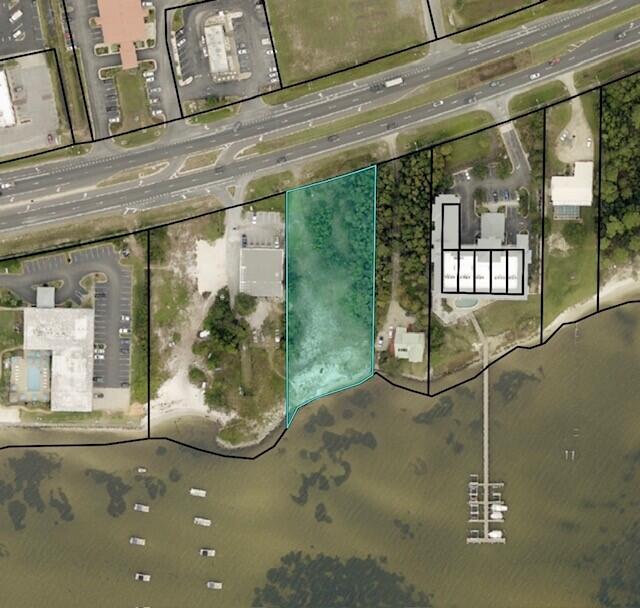 Great commercial waterfront lot in located in Navarre on Navarre Pkwy next to Half Hitch Tackle, property has a new sea wall and dock permit are in place with 158' of road frontage and 108' of waterfront on the Intracoastal waterway, beautiful views, great waterfront property for commercial development