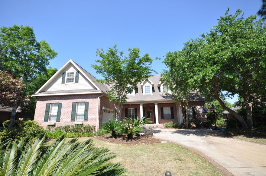 STUNNING & SPACIOUS custom Chicago brick/hardy board executive home located in the gated & highly sought after Windward neighborhood in Bluewater Bay. This home is nestled amongst the trees & professionally landscaped yard on the 7th fairway of the Bluewater Bay Golf Course. There is more than enough room for everyone in this 4200+ sf gorgeous home w/5 bedrooms PLUS an office. 1st Floor Master. Right at the front entry, you are welcomed into the home with a striking Eucalyptus front door & hanging gas lamp. The home has an abundance of intricate custom woodwork, Australian Cypress flooring, and plantation shutters. Gourmet kitchen is lavishly equipped offering furniture-quality stained Maple cabinetry, wood paneled refrigerator, Dacor 6 burner gas cook top w/gril