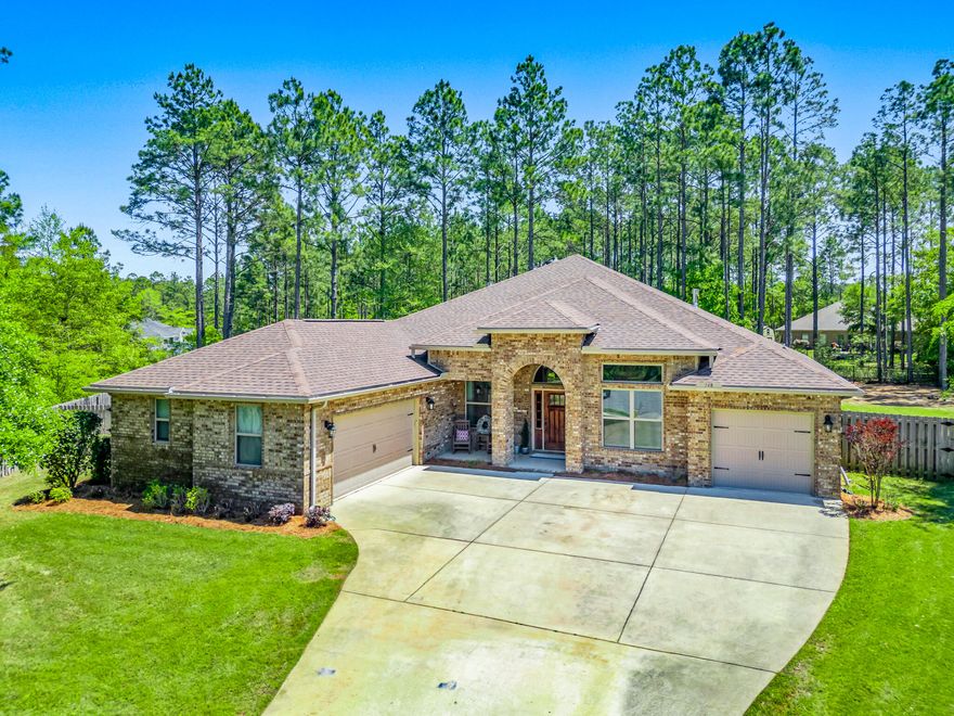 Uniquely situated at the end of a cul de sac. This home has a privacy fence, backs up to the nature perserve.and is beside a HB nature trail.  A 3238 SF, 3 car garage home wi/ 12' coffered ceilings. This 4BR/3BA home upgrades inc,- custom lighting throughout, beautiful dining room, enclosed office, spacious gourmet kitchen w/ stainless appliances, large island with double sink, 42'' tall cabinets, tile backsplash, walk-in pantry, butler's pantry/coffee bar, and a gas cooktop with wall oven. The home has tile plank floors throughout inc. the master bdr. Carpet in the extra bedrooms. The impressive Master Suite has an entry foyer and extended master retreat area w/sliding Barn doors., M bath includes a walk in tile shower, garden tub, dual vanities and large walk-in closet. The Laundry room is huge! It has a built in king size Murphy bed which provides a "5th bed/sleeping option". The hallway leading out to the garage has custom built-in cubbies providing a great drop zone for coats, bag, shoes, etc. There is a total of 3 car garages and an ample driveway for plenty of parking. All of these upgrades and nestled in the beautiful community of Hammock Bay! The community has  resort style amenities- pools, fitness ctr, tennis, pickleball, a general store and Brewery - all within walking distance. 