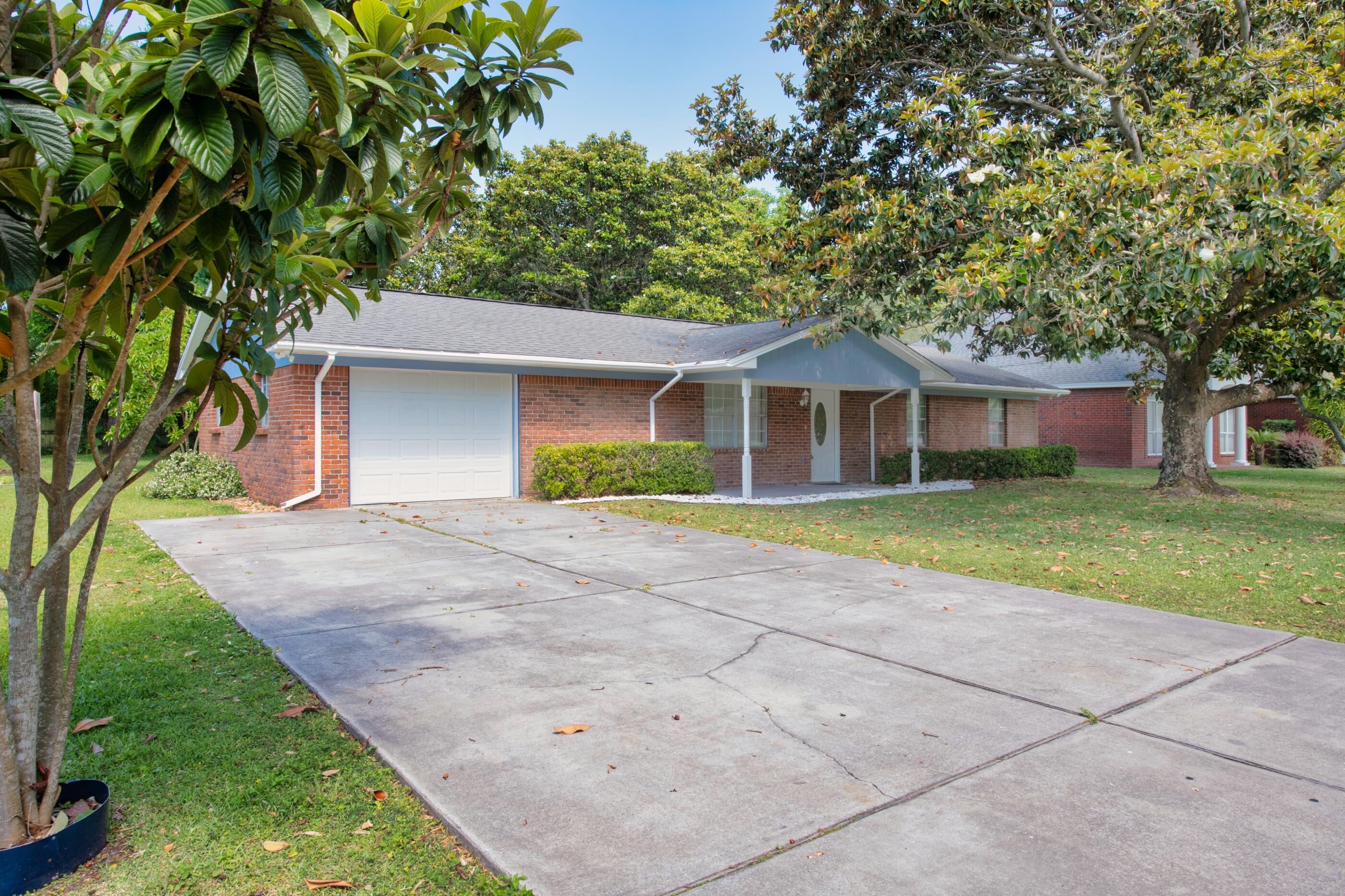 Back on the Market! No fault of the seller. Welcome to your new home in the heart of Destin! Enjoy quick access to the beaches, shops, and everywhere you want to go! As you approach your new home you'll fall in love with your large .25 acre lot with a mature magnolia tree in the front yard. As you enter the house through your large covered porch, you'll enjoy the large open family room that opens into your dining area and kitchen. Head to the left of the house and you'll discover your separate mud room/laundry room on your way into your sizable 1 car garage. As you head back toward the other side of the house, you'll notice a large kitchen with lots of natural light, a breakfast bar, and plenty of counter and storage space.