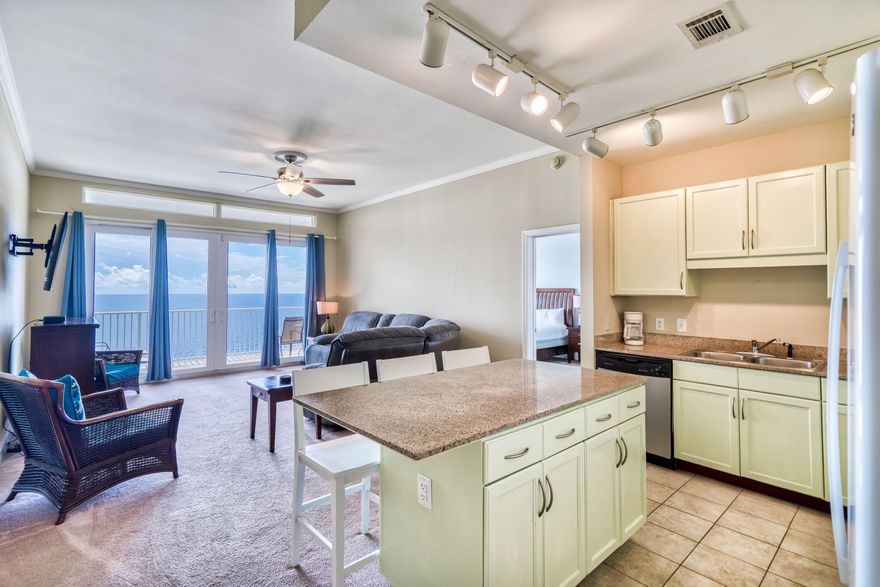 Welcome to Laketown Wharf, Penthouse Unit #2022; a fully furnished, 2-bedroom, Gulf-front condominium located in Panama City Beach! Just steps away from the private beach access located across the street; this condo is built with intention and elegance. Unit #2022 features two bedrooms, two bathrooms, 10ft ceilings, and 1,262 SF of living space. Upon entering the unit, you will be greeted with breathtaking gulf views. Down the hallway that includes the guest bedroom, private flex space with room for bunk bed, and guest bathroom. Travel to the southside of the unit, where you'll find the open-concept kitchen and living area. There, gorgeous views of the Gulf of Mexico will absolutely stun you. Enjoy the views, and your afternoon cocktail, from the central balcony- which is accessible