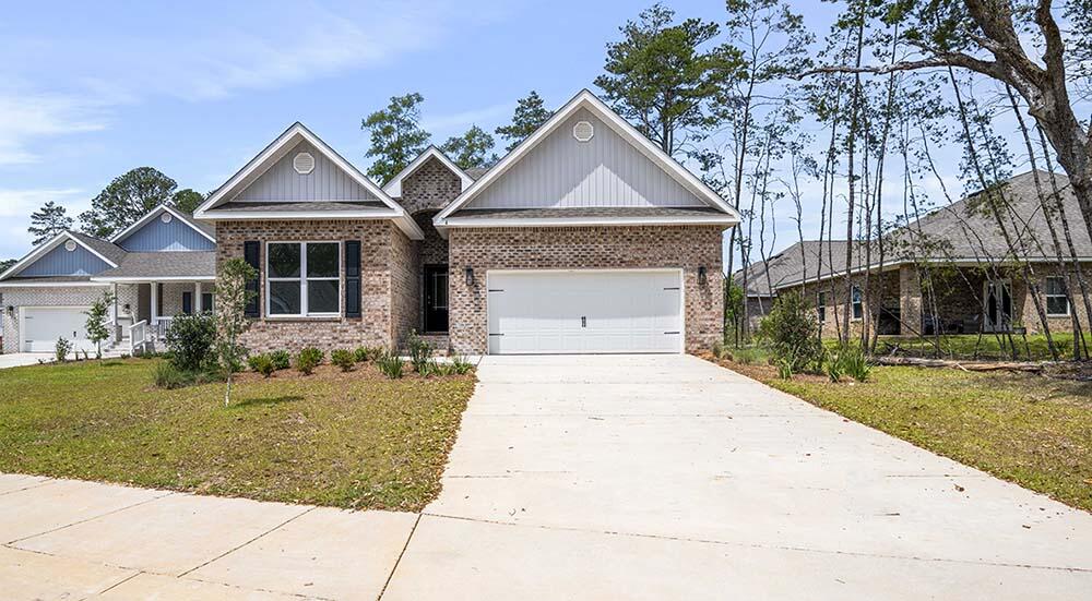 Limited Homesites Remaining! New construction at Live Oak Harbor located in Freeport, Florida. This beautiful new community features heavily wooded lots, Less than half a mile to the Freeport Marina and on LaGrange Bayou. This community is perfect for anyone who wants to enjoy the benefits of living by the water with the feel of a private neighborhood. The 'Kennedy' plan features a spacious back porch, Hardie siding, 9' ceilings, EVP flooring, Ivory shaker style cabinetry in the kitchen and bathrooms, quartz countertops, and a modern tile shower. This energy efficient home offers 'Home is Connected' Smart Home package, DEAKO switches, 1-year builder warranty and 10-year structural warranty.