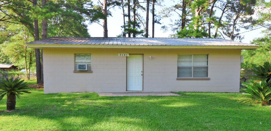 Great find! Amazing views of a gorgeous lake are just the beginning of the attributes of this cute city home. Metal roof, large fenced in back yard, and the concrete padded side patio are wonderful exterior features. Inside you will find newer flooring, paint, and electrical. This home would make a great rental/investment property for you or an affordable and comfortable place to live. If you want 2 homes, the adjoining home is available as well with the same layout and for the same price. Location is in the city...within 35 miles to the international airport and ''The World's Most Beautiful Beaches'' of Panama City Beach.