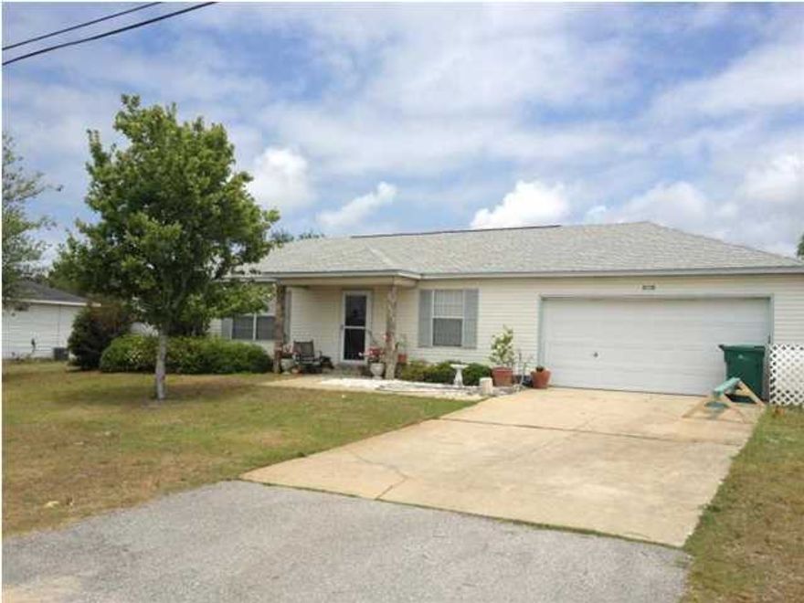 WELL KEPT! 3 bedroom/2 full bath split floor plan. In walking distance to Restaurants, Neighborhood Ice Cream Shop, Culvers, Winn Dixie, Navarre Children's Park, and much more. The Front Door has a Fancy Storm Door with Drop Down Security Screen. There is Neutral Tile in kit/dining/bath/foyer and Neutral Carpet in Living Room & Bedrooms. Sliding Glass Doors in the Dining Area lead to the Patio Perfect for the BBQ. Large fenced in back yard. 10X13 Utility Shed. Automatic Sprinkler System on Well Pump & Septic Tank (Very Low Water Bills for you & No Sewage Expense). Smoking is not permitted. Call for an appointment.