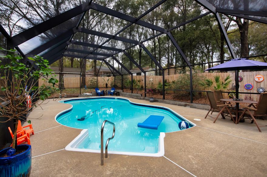 CRESTVIEW POOL HOME WITH IT'S OWN BACKYARD TROPICAL OASIS IS NOW AVAILABLE!  

Welcome to 2412 Mill Run Drive! This impressive 2-story home is meticulously maintained and features 4 bedrooms, 2 baths, and a SPARKLING ENCLOSED POOL!

Enter the home through a solid wood door, with stained glass accents! The living room is spacious and boasts cathedral ceilings, a wood-burning fireplace and stained glass window. 

 The DELUXE-SIZED KITCHEN is well-appointed, with NEW BLACK STAINLESS REFRIGERATOR AND DISHWASHER... GORGEOUS IMPORTED GRANITE COUNTERS... OAK CABINETRY WITH COUNTERTOP LIGHTING... and a PLANT WINDOW!  Fresh grown herbs anyone? 

Coffee addicts will appreciate the extra counter space for a designated coffee bar. There's also designated dining space, and a small outdoor patio area for those who prefer dining outside. 

The MASTER SUITE is its own PRIVATE RETREAT with French doors leading out to the enclosed pool. 

All remaining bedrooms are upstairs.  Each one is spacious, with wood laminate flooring... roomy closets... and large windows that flood the rooms with natural light.

CURB APPEAL?  Absolutely! You will find thoughtful landscaping design in the front of the home and back. There's also a spacious shed for all gardening tools and equipment.. as well as separate pool equipment storage.  

As previously mentioned, this pool is SPARKLING courtesy of meticulous owners! IT ALSO COMES WITH A DIVING BOARD! Who's ready for the next pool party? 

BONUS...County Taxes, and quick commute to bases! Make your appointment today.