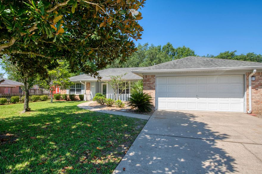 Beautiful 3 bed, 2 bath Open-floor plan home is located minutes from Pensacola NAS. The yard has mature trees and a large front porch. When you walk in, freshly painted interior and new carpet are welcoming attributes for this home. The vaulted ceilings of the living room give this area a very spacious feel and the fireplace gives it warmth. The formal dining room, and large eat-in kitchen with breakfast bar make this home great for guests and entertaining. A tiled sunroom is perfect bonus space for many activities. The master suit features; recessed lights, trey ceilings, a garden tub and shower, double vanities, and two walk in closets. The fenced backyard has shed,and yard has plenty of room for activities. Bonus, a great location only minutes from schools and Big Lagoon Park.