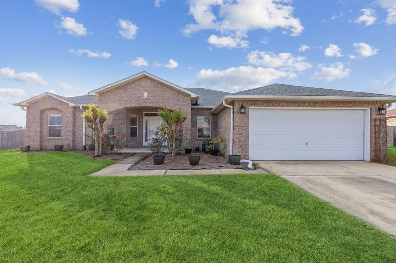 This beautiful home is located in the sought out subdivision of Carnegie hills. In addition to having 4 bedrooms this home offers an office space with French doors and built in shelving. The kitchen has been updated with granite counter tops, new tile flooring and a designer sink. A water softener/ purifier has been installed.This home offers beautiful updated vinyl flooring throughout the main areas. The home has a split bedroom design. The master has a sliding door leading to a cover patio. The backyard is fence in and is .51 of an acre with plenty of room to add an inground pool. This home has gutters and a sprinkler system. The garage door has been insulated as well as the exterior walls and attic. This subdivision has sidewalks and street lamps and so much appeal. Take a look toda