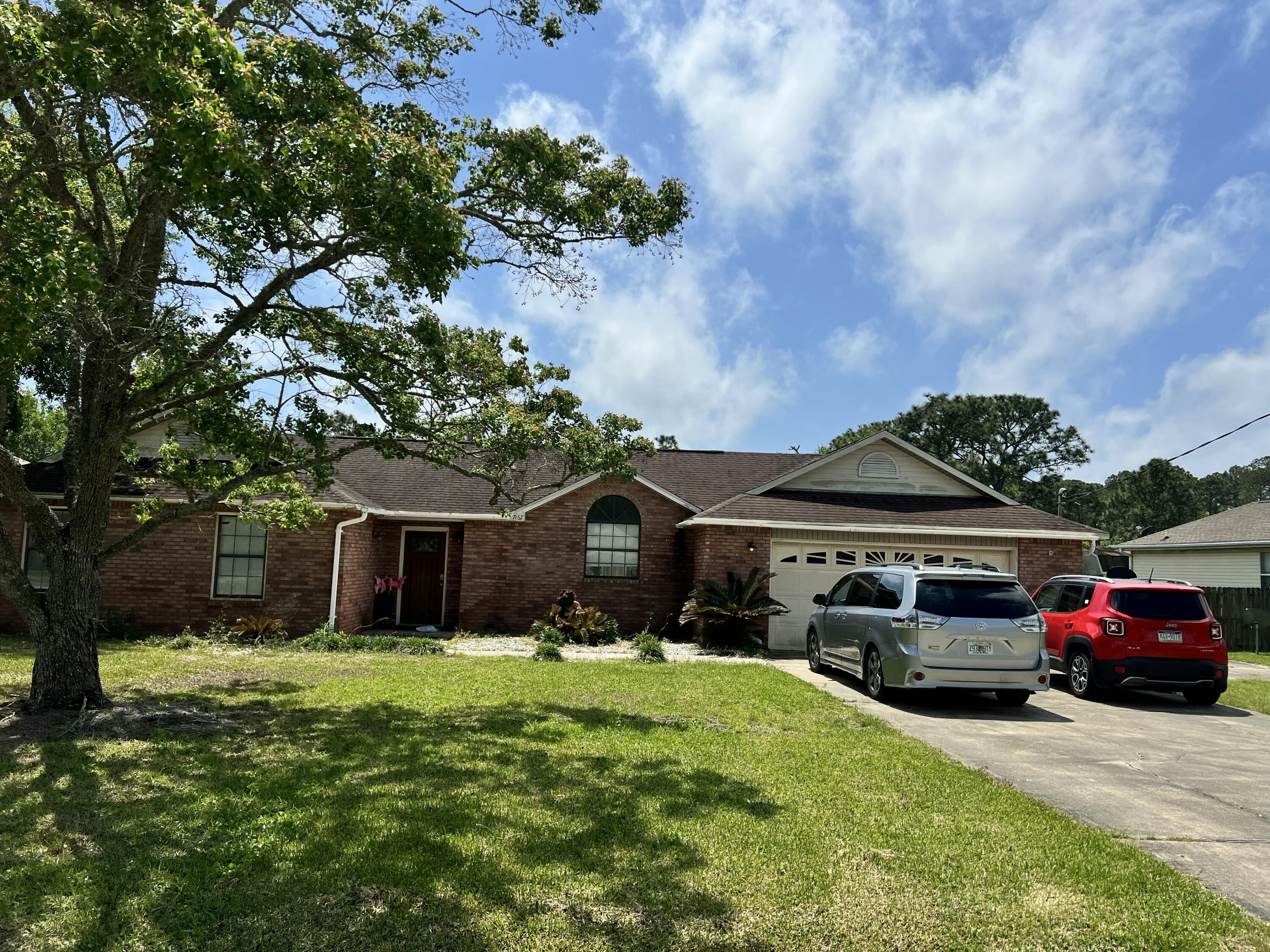 This Spacious Custom-Built 4 BR 2.5 BA home on nearly half an acre (.46 acres) is full of potential and ready for your personal touch! Due to the age of the roof, this property will likely require cash or renovation loan financing. Inside, you'll find 4 bedrooms and 2.5 bathrooms, with wood flooring in the Living/Dining and tile throughout the rest of the home. A custom Front Door greets you and there is a half bath for guests near the entrance. Vaulted ceilings are in the main living areas and the primary suite. The open-concept layout features a large great room with a cultured marble fireplace, an inviting dining area, and a functional kitchen complete with beautiful wood cabinetry, a glass-top range, & refrigerator. The Master Bedroom is spacious and the Master Bath has Cultured Marble Jacuzzi Garden tub, separate shower, and dual vanities. Additional highlights include an oversized garage with attic storage, an extra-wide driveway, tiled front walkway, and a tiled back patio and porch - perfect for enjoying the outdoors! While the home needs a new roof and some cosmetic updates (such as small sheetrock repairs), it is structurally sound and full of potential! Water heater replaced in 2017. Located in the sought-after Holly by the Sea, where residents enjoy access to a wide range of amenities, including a large recreation center with indoor and outdoor swimming pools, a full gym, 8 clay tennis courts, RV campsites, event rental beach house, youth programs, a nearby boat launch, and more! HOME IS SOLD AS-IS.
