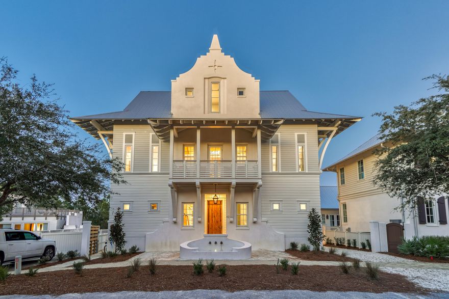 42 West Kingston Road: A Rosemary Beach MasterpieceThis exquisite 6,300-square-foot custom home redefines luxury living in Rosemary Beach. From the moment you arrive, the meticulous attention to detail is evident. A covered entry porch with a cascading water fountain welcomes you, leading to a handcrafted front door and into a breathtaking double-height foyer. Grand Living Spaces

The foyer sets the stage for the home's grandeur, featuring a custom-designed two-story chandelier, raw steel handrails, and a floating live-edge wood staircase. An elevator provides convenient access to all three levels.

The open-concept living area seamlessly connects the kitchen, dining room, and living room, creating an expansive and light-filled space. Soaring 12-foot ceilings and floor-to-ceiling windows enhance the sense of spaciousness and offer captivating views of the pool courtyard.

Culinary Delights and Private Retreats

The gourmet kitchen is a chef's dream, boasting custom cabinetry, high-end appliances, and a large island that extends into the dining room. A full bar, floating ceiling with a custom chandelier, and arched openings complete the dining experience.

The first-floor master suite is a haven of tranquility, featuring a beamed ceiling, fireplace, dual closets, and a luxurious spa bathroom with a large shower, Jacuzzi tub, and oversized vanity.

Outdoor Oasis and Upper-Level Luxury

Step outside to the courtyard and discover a private oasis. A saltwater pool with a swim-up bar, waterfall, and spa jets invites relaxation, while a covered outdoor living area with a summer kitchen, full bar, and fireplace provides the perfect setting for entertaining.

The second floor hosts three master suites and an oversized bunk room, each with an en-suite bathroom, large closets, and private balconies. A spacious den overlooks the grand foyer.

The third floor boasts another lavish master suite with a sitting area, wet bar, and private balcony, plus a bunk room with an attached bath. A crow's nest balcony offers rooftop views.

Unique Carriage House

A separate carriage house provides additional living space with a vaulted ceiling living room, fireplace, kitchen, two bedrooms, and two bathrooms. This private annex is perfect for guests or extended family.

Additional Features

Single-car garage
Large motor court
Private driveway
42 West Kingston Road is more than just a home; it's an experience. With its unparalleled craftsmanship, luxurious amenities, and prime location, this Rosemary Beach compound offers the ultimate coastal retreat.