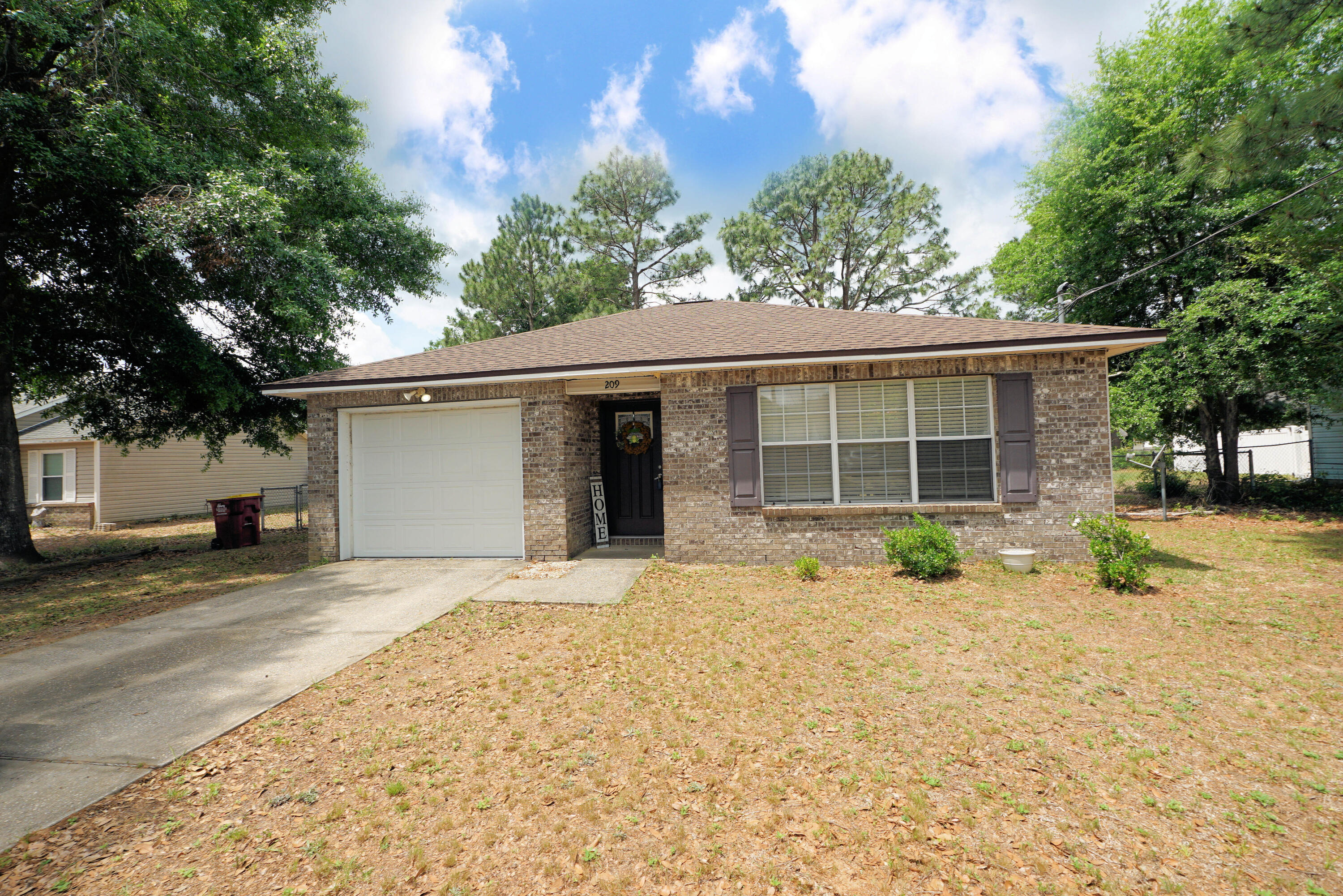 Great location for this perfect Florida home! South of I-10 will ease your daily commute. As you enter the house, you'll find the family room, with a tray ceiling accent. Then proceed to the eat-in area of the kitchen. The galley kitchen has everything you need to prepare memorable meals for the family. You can easily serve your meals alfresco, as the back patio is accessed just off of the kitchen. The laundry area is in hallway. The two guest bedrooms share the full, hall bath, while the primary bedroom has an en suite full bath with double vanity. Enjoy the attractive, easy care LVP throughout most of the house. The HVAC was installed in 2023, the water heater in 2020 and the roof was re-shingled in 2021. This house is move-in ready!