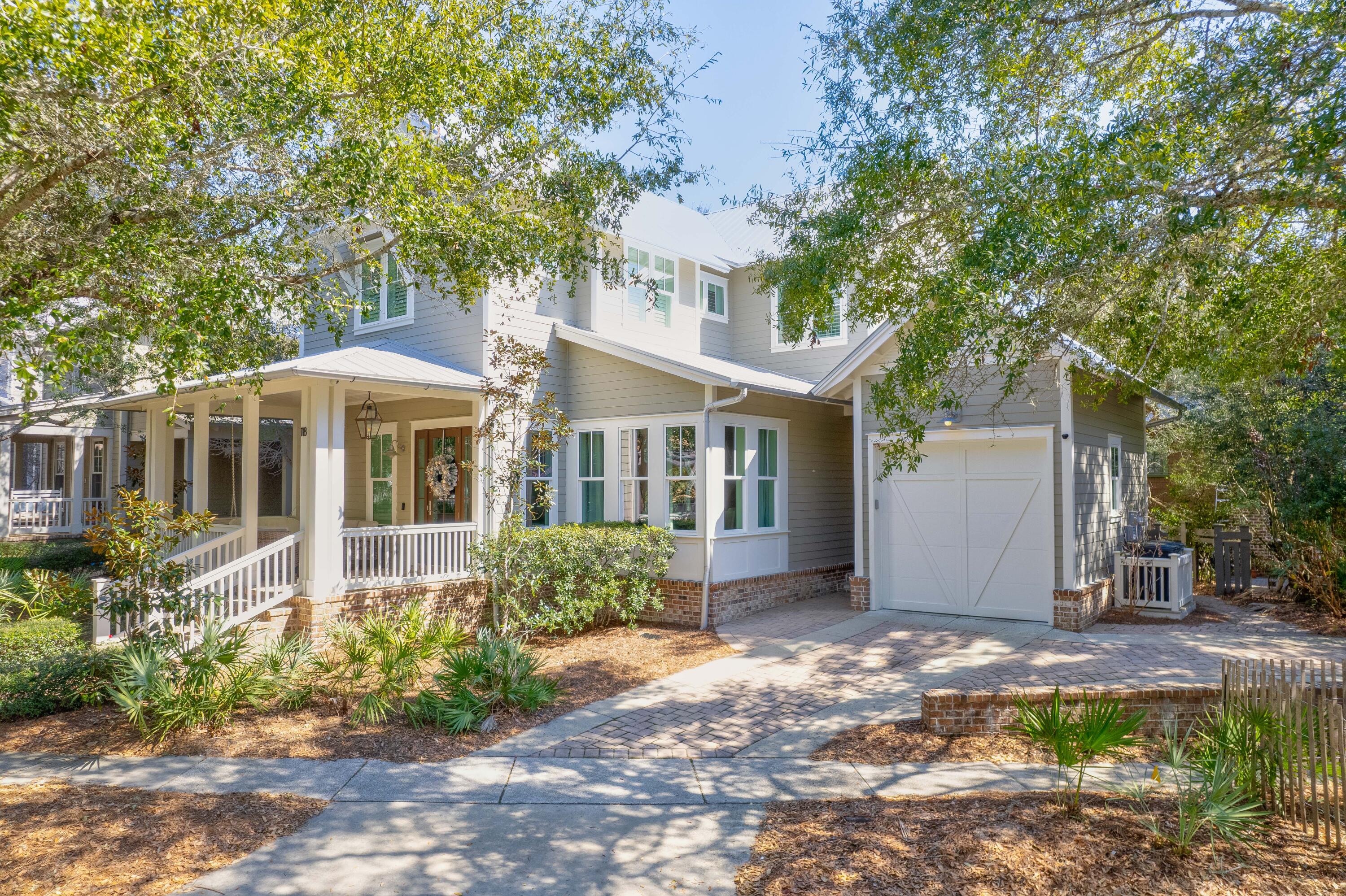 Come see the epitome of Floridian luxury at this immaculately maintained, meticulously designed 2493 Sq ft Residential Single-Family Home. Boasting four spacious bedrooms & five bathrooms, this dwelling is comfortably nestled in the inviting community of Forest Lakes on 30A in Santa Rosa Beach. Adorned with sophisticated hickory wood floors, the home marries modern elegance with a warm, welcoming aesthetic. The living spaces are generously appointed with fabulous furnishings, all of which are included in the sale. A large family-sized breakfast bar, gas appliances in a state-of-the-art kitchen, and a gorgeous dining room promote fine dining experiences. Embrace outdoor living with handsome screened-in porches and a huge front porch - perfect for savoring sunlit mornings and tranquil twilight evenings. An outdoor shower adds to the property's charm, along with the convenience of an attached garage plus additional driveway parking. Peace of mind is guaranteed, thanks to a robust security system. Revel in the beautifully-kept amenities of the community pool, park and biking areas while soaking up the picturesque lakes and walkover views. As a coveted vacation rental, this home has bookings firmly in place for the discerning investor. Experience the perfect blend of function, fun, and relaxation in this Floridian haven. Don't hesitate, step into your dream lifestyle today by scheduling a showing or contacting us for more information. We invite you to live the luxury coastal lifestyle that only 30A can offer!