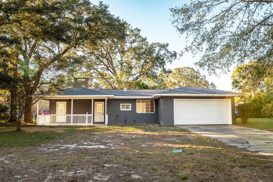 Attention Mid-Century Modern Lovers! NEW ROOF! Updated all block home with a 2 car garage located on a large versatile lot that offers access from both Bremen & Calhoun to include a fenced in backyard with a double gate. Home is move in ready and updated: new flooring, fresh paint, brand new stainless steel appliances, wood cabinets and a fresh backsplash. Kitchen has a gas, 6 burner stove and concrete countertops with a breakfast bar. Bathrooms have been remodeled with new toilets, sinks, shower surround and bathtub and tile. Each bedroom features 2 closets for plenty of storage space. Living room is flooded with natural light from the unique and original windows and beautiful wood burning fireplace & built in shelving. Yard has mature trees, concrete patio perfect for entertaining.