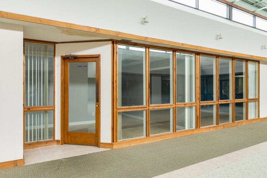 This office has a waiting room/lobby, conference room, 4 offices, common area with French doors 1 Uni-sex restroom. Tile hallways with carpet in offices