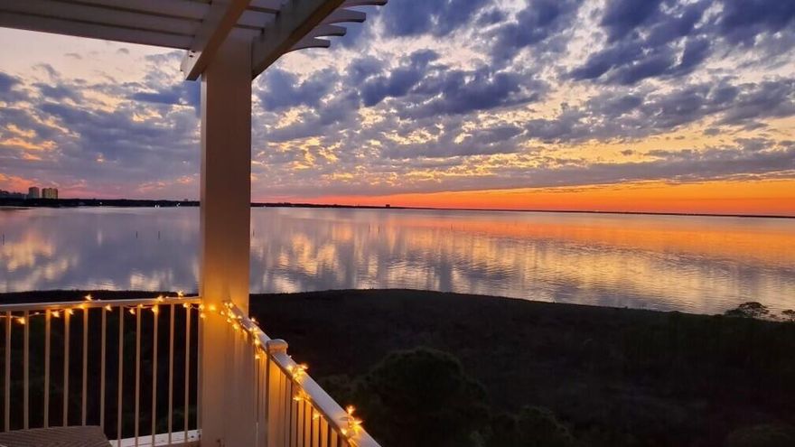 Panoramic views of the Choctawhatchee Bay will grab your eye from every room of this top floor Elation condo. Unwind at the end of the day while lounging on the balcony taking in a breathtaking sunset or watch as the boats return at the end of the day. The subtle hues of cream and grey create a serene and calming environment to call home. This lock-off unit provides the opportunity to maximize your rental capabilities by giving the owner three different rental options (2-bedroom, 3-bedroom, & studio).Upon entering through the door you are greeted with an abundance of natural lighting and tall 9-12' ceilings. The chic dining table comfortably seats 4 with additional space at the breakfast bar. The L-shaped couch gives everyone enough room to cozy up for a night in.