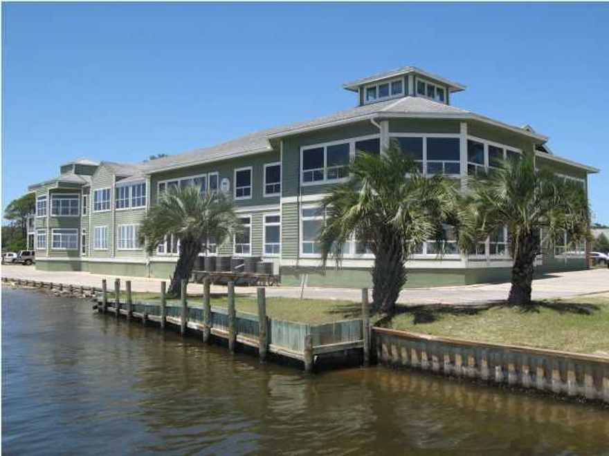 This office building is located in Paradise Village, a waterfront office and retail complex with one to three story clapboard buildings designed to resemble a New England fishing village. The property is divided by a canal and the buildings meander along the water and are joined by a continuous length of decking. The complex has over 400 feet on Santa Rosa Sound. This building fronts Santa Rosa Sound with outstanding views of the sound and from the second floor you can even see the Gulf of Mexico.