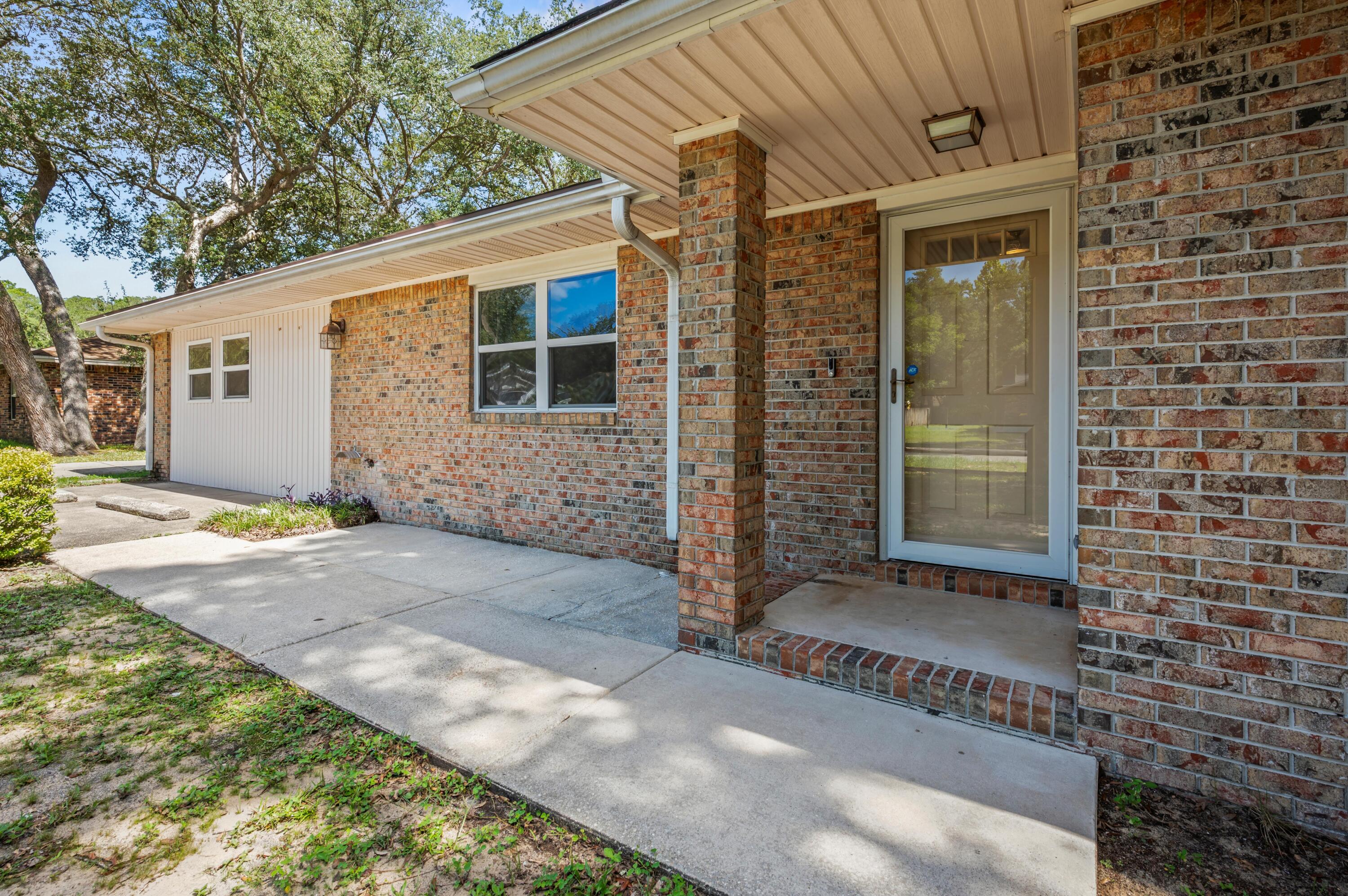 VA Assumable Loan available with a 2.75% interest rate!! Discover your dream home in this charming and spacious 4BR, 3BA home plus a large Florida Room nestled in a prime Niceville location! This great home offers a welcoming layout for you and your family to enjoy and its great location within only minutes from shopping, restaurants, A+ schools, and military bases make this the perfect home you have been searching for in Niceville! This lovely home has TWO master suites in addition to two spacious bedrooms (one with built in wooden bookshelves) sharing a hall bath. Solid-surface flooring throughout with hardwood and tile. The formal living room and dining room are both easily accessible from the well -equipped kitchen with dine-in kitchen area & laundry room adjacent to the kitchen. The kitchen boasts 42'' maple cabinets, Corian counter-tops, recessed lighting, gas stove/oven (2019) and offers a ton of natural light, which brings together all the elements of a great home. Heated/cooled Florida Room to enjoy the sunlight and plenty of room to entertain friends! This Florida Room has so much natural light from all the windows and could easily serve as a great playroom, family room, or den; there are so many options.
Recent updates include a newer roof (2020), 10' of attic insulation, HVAC (2017), new water heater (2023), new refrigerator and dishwasher (2021).
You will love the huge, fully fenced back yard from the Florida Room located off the kitchen and dining room. With a large 0.34 acres lot this home offers enchanting outdoor spaces, and its sizable backyard where one can unwind in the tranquil sitting area or indulge in fun activities!
One can truly relax and enjoy the beauty of the outdoors in this special spot! There is a yard building for extra storage and a shade structure in the back yard being offered As-Is.
Home has a detached 1- car garage and an extended driveway for extra parking that is functional and convenient with ample space for your outdoor toys.
Tucked away in a quiet cul-de-sac this home has it all; space, location, and freedom to live your way. With no HOA, and with being so close to Eglin, ideally located near top-rated schools, parks, great shopping/dining and the sugar-white beaches of Okaloosa County your family will thrive.
Don't miss this opportunity to become a homeowner in an established neighborhood with sidewalks, mature landscaping, and zoned for top-rated Niceville schools!
Call for your appointment today!