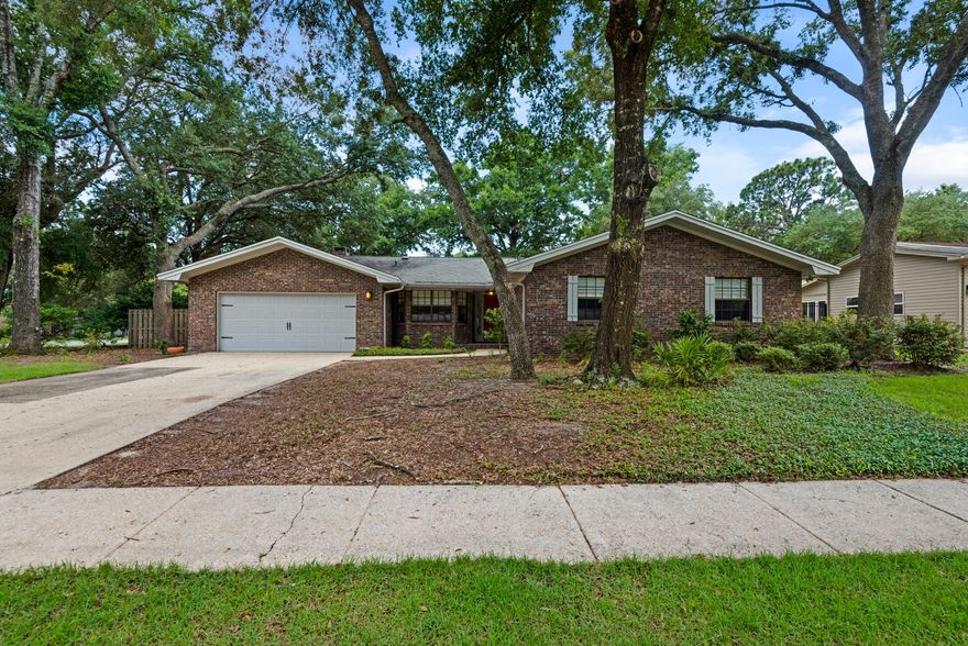 Centrally located in Niceville with close commutes to Eglin AFB, Duke Field and 7th Group Special Forces Compound. This brick home features 4 bedrooms and 2.5 bathrooms. Sellers worked with Randy Rise remodeling and made serious improvements to this spacious home. Kitchen is light and bright with granite counter tops, updated cabinetry & backsplash, and stainless steel appliances. Flooring includes oversized tile in main areas with wood in master bedroom and carpeting in additional bedrooms. Crown molding in main areas, updated lighting throughout and a brick fireplace with gas as living areas focal point. Large corner lot with oversized back yard for entertaining and enjoyment. Sprinkler system and lawn pump, not to mention a 15x18 workshop. Come see this gently lived in updated home.