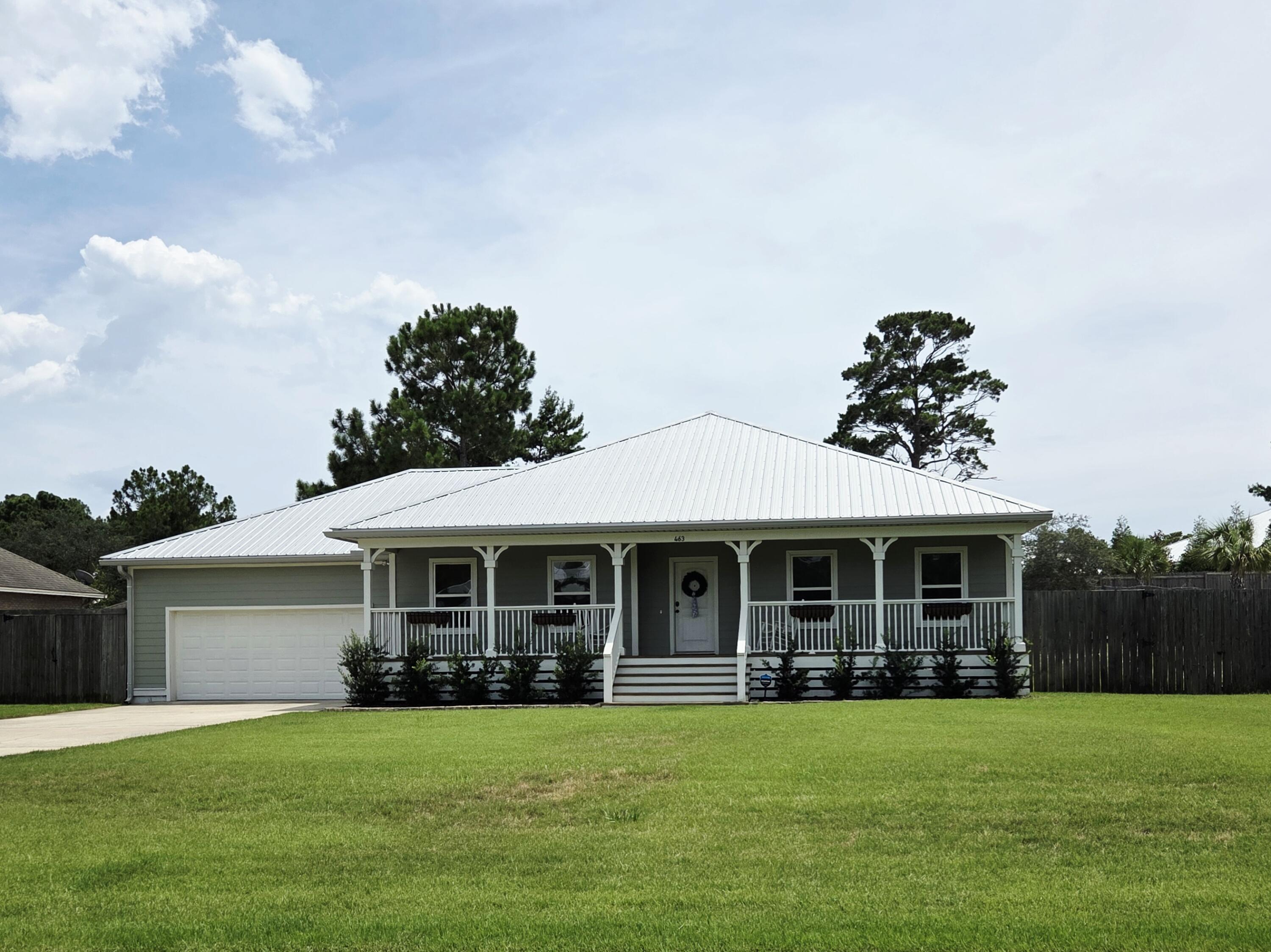 Where else in South Walton can you find a newer home on a .62 acre lot so close to the beach with NO HOA? This unique home is ''insurance-friendly'' built in 2018 with a metal roof on a high and dry .62 acre lot. Great location only 1.2 miles to Ed Walline Beach access and Gulf Place restaurants, coffee shops, stores, etc. With 1909 sq. ft. of heated and cooled space plus another 1325 of porches and a 2-car garage for 3234 Total sq. ft! Recent improvements include NEW HVAC, NEW PAINT INSIDE AND OUT, NEW SOD, NEW IRRIGATION SYSTEM, NEW GUTTERS, NEW CUSTOM CLOSET, NEW LAUNDRY ROOM CABINETS, SINK AND COUNTERTOPS! From the front porch enter the spacious living area with vaulted ceilings and wooden beams, into an open floor plan with kitchen, bar and dining area making it easy to entertain! The double doors lead to the primary suite with windows overlooking the huge back yard. The primary bath has an extra large shower, double vanity and separate water closet. Stay organized with the new custom closet system in the primary closet. The other 2 bedrooms overlook the front porch are light and bright and one is used as an office. The laundry right off the kitchen/dining area and leads to the 2 car garage with workbench and plenty of storage in the attic. The screened porch off the living room offers a great space for pets, yoga, or just relaxing. Let your imagination run wild with what you could do with the fenced back yard! Whether you want to make memories with your friends and family or make money with a vacation rental, this property offers plenty of opportunities! There's plenty of room for a pool, pickleball court, putting green or a home addition and there are parks, bike paths, Publix, and the Cessna Boat Ramp nearby!