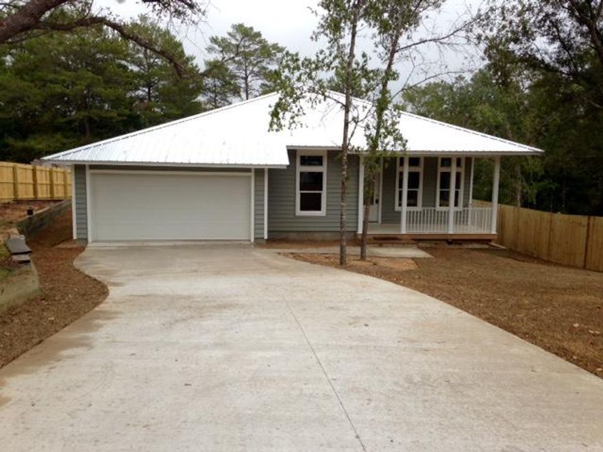 Great opportunity to own a brand new home with tons of upscale features! This home has beautiful landscaping and a spacious front porch to add to its curb appeal. Split, open floor plan with tile floors, 10' ceilings, and carpet in the bedrooms. Kitchen is loaded with granite countertops, gas stove, stainless steel appliances, recessed lighting over the breakfast bar, and huge kitchen pantry. Master bedroom is located in the back of the home with double vanity in bathroom and enormous walk in closet! The master provides private access to the screened back porch with beautiful wooded view! Large backyard with 6' privacy fence. This home offers close proximity to military bases, great schools, restaurants, and state park. Call today for your showing!