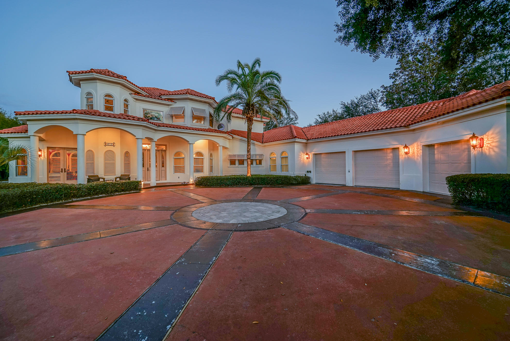 Absolutely Gorgeous Mediterranean-Style custom built pool home situated on a lake in gated Magnolia Plantation. Home is ideal for entertaining or for a large family. First floor with huge master suite, 2 walk-in closets, new masterbath including tile and bidet. Large formal living and dining rooms, kitchen, office, laundry and 1/2 bath. Amazing kitchen features 2 Subzero refrigerators, 4 Subzero drawers plus extensive custom cabinetry. Family room has a large fireplace and wood accent wall. Upstairs has 3 more bedrooms, one with ensuite bath, second family room, wet bar, full bath plus storage room. Large screened custom jetted pool has multicolor lights. Fenced area in yard, plus covered deck on each floor overlooking the lake. Oversized 3 car garage, one bay heated & CLICK ON MORE...