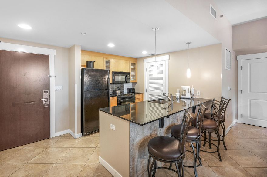 Highlights include: Bay Views & Sunsets: West-facing ground-floor unit with peaceful Choctawhatchee Bay and sunset views. Flexible Layout: This is a lockout unit allowing versatile rental options as a studio, 1bed/2bath, or a full 2bed/3bath unit. Low Maintenance: Tile flooring throughout the condo ensures easy upkeep. Luxurious Amenities for Bahia : includes access to a fitness center, a resort-style swimming pool, the Ballyhoo Bar and the private Solstice Club an amenity for owners and guests featuring grills, screened porch w/ gas fireplace, indoor bar, flat screen tv and comfortable seating inside and out. In addition the pedestrian Village of Baytowne Wharf and Hotel Effie, located adjacent to Bahia with a rooftop pool & bar and fine dining at Ovide. Fully Furnished! Rental Ready!