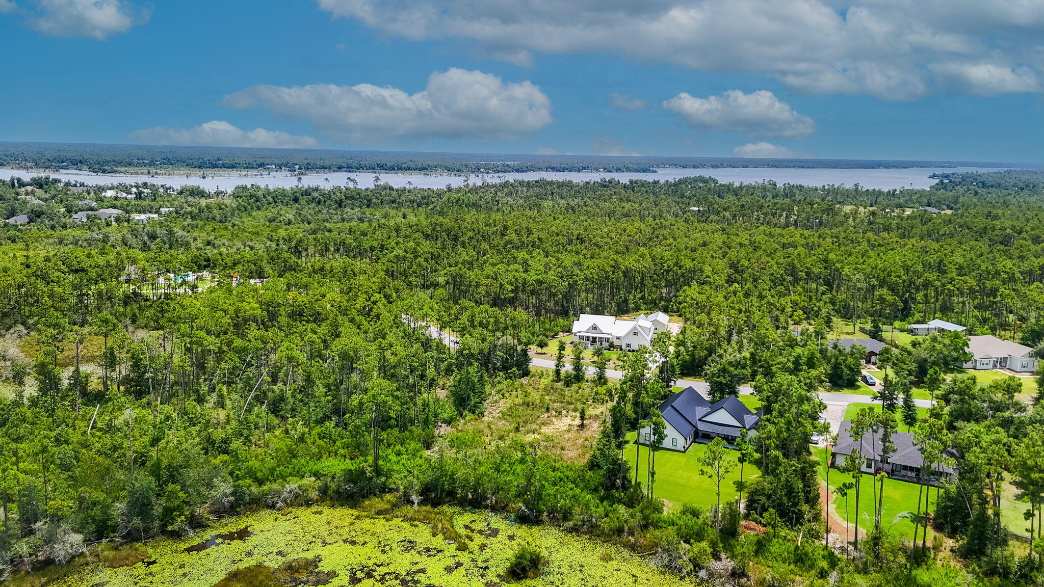 Build your dream home with water views in the gated community, Cedar Creek at Deer Point Lake. This spacious .64-acre homesites backs up to a tranquil pond, offering peaceful water views and a picturesque setting! Seize the opportunity to create your custom dream home in this highly sought after community. Imagine designing your ideal lifestyle with room for a pool, detached garage, expansive backyard, and everything in between. This homesite is the perfect canvas for your forever home or a private retreat. Cedar Creek is a beautifully designed, gated neighborhood that embraces nature while offering exceptional amenities--including a community pool, playground, clubhouse, golf cart-friendly roads, and generous greenspace throughout. Enjoy the laid-back charm of country living just a short drive from the shopping, dining, and adventure of Panama City and nearby Econfina Creek.
Love fishing? You'll be steps from renowned freshwater fishing in Deer Point Lake, known for its bream, bass, and shellcracker. Also enjoy a community dock to fish from just steps from your door.
Don't miss this rare opportunity to own in a peaceful, established community with low HOA fees and high livability.
This area is also available for USDA 100% financing! Start building your vision today! Survey available.