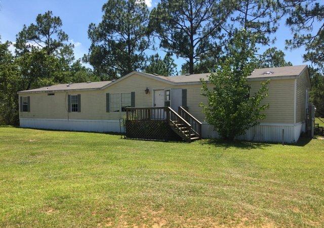 REO ~ This 4 Bd / 2 Ba home is situated on .66 acres & offers plenty of yard space. The interior of the home offers both a formal living & dining area. The kitchen has ample space & is open to the den with fireplace. The master suite offers double vanity, garden tub & separate shower. The property also offers an over sized workshop on slab. This would be great storage, mechanics room or wood working area...the possibilities are endless. Don't miss out on this great home. Prior to seller receipt and approval of the full title package from foreclosure, title to the property will be conveyed by a quit claim deed.