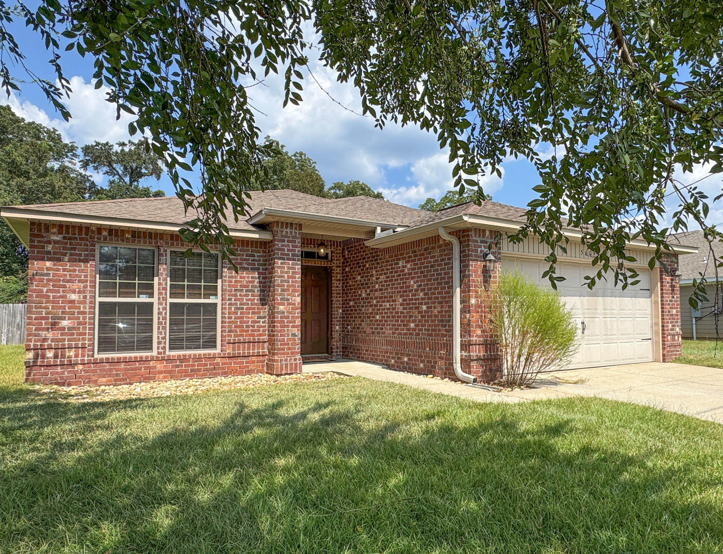 This all-brick 3-bedroom, 2-bath home offers the perfect blend of comfort, style, and convenience. Featuring 1,922 sq. ft. of living space, a two-car garage, and a large fenced backyard on a .36-acre lot, this property is a true find. Beautiful luxury vinyl flooring leading into a spacious open floor plan. The family room flows seamlessly into the dining area and kitchen, complete with granite countertops, stainless steel appliances, a wrap-around breakfast bar, ceramic tile flooring, and ample cabinetry. A walk-in pantry and separate laundry room add to the home's functionality. The private owner's suite is tucked away just off the family room and features double doors, a spacious walk-in closet, dual vanities, soaking tub, and separate shower. Two additional bedrooms and a second full bath are thoughtfully designed for comfort and privacy. Enjoy the outdoors with a large fenced backyard, perfect for entertaining, gardening, or relaxing under the covered back porch. With no HOA. Ideally located near Baker School and just a short commute to local military bases, shopping, and dining, this home is move-in ready and waiting for you. Don't miss the opportunity to make 5609 Price Plantation Rd your new address! Photos will be added soon.