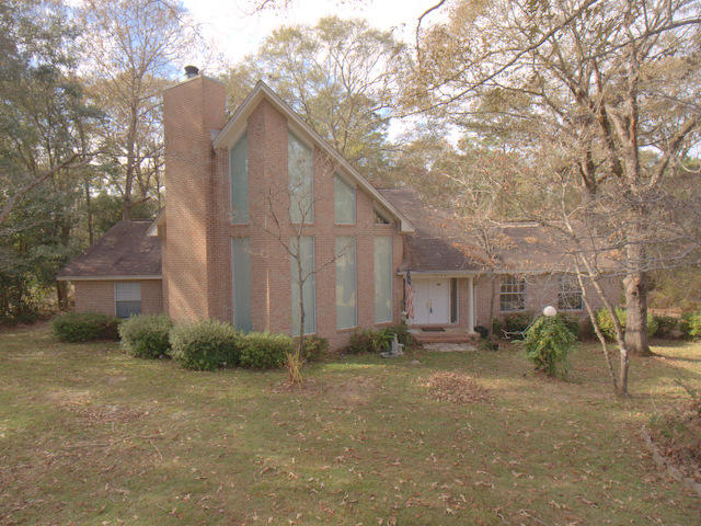 This is a ''one owner'' custom built home with soaring 25 ft Cathedral ceilings. The master suite is upstairs overlooking the great room and the beautiful fireplace surrounded by a stone wall going over 20 ft high. This home has so much potential to satisfy many different wants and needs in a home. Situated on a one acre lot with mature shade trees and plants, there is a long paved driveway leading into the side load garage. Out back is very peaceful, with expansive decking for entertaining large crowds. Inside there are 3 bedrooms with 2 on the main level and the master suite is located upstairs by itself, away from it all. This established neighborhood is a much sought after area in North Crestview that isn't available very often, so take a closer look today. Low, county property Taxes.