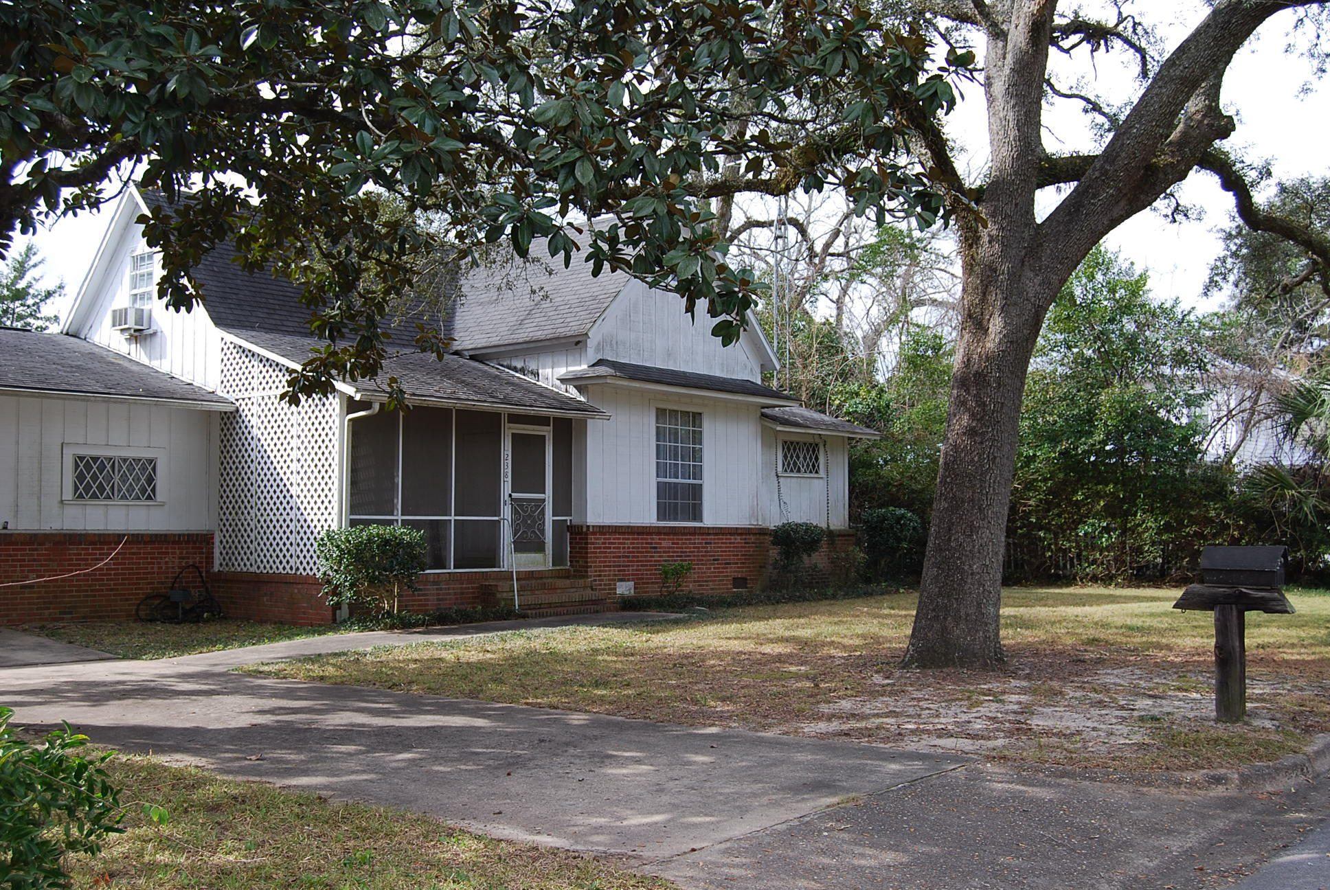 MAKE OFFER!! Rare opportunity to own a home built in 1910 in historic DeFuniak Springs, just one block from Lake DeFuniak. The home offers many possibilities. Downstairs are 3 bedrooms (one guest suite) and 2 baths. Original claw foot tub in master bath. Upstairs is loft area (40X14) that includes a half bath plus closet area. Enjoy your afternoons on the screened front porch. Behind the home you will find a mother-in-law/guest house (380 sq ft) with a bedroom, full bath and walk in closet. Also in the back one will find a detached carport plus large workshop that has all the characteristics of an original carriage house. The back yard fronts an alley way, typical of the historic district. Being sold AS-IS!!!