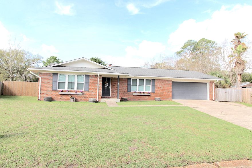 Beautiful home, remodeled and updated! Nice open layout. Kitchen has been updated with granite counter tops, stainless appliances, and a large island with bar seating great for entertaining. There is also a breakfast nook that overlooks the large backyard. The living room is spacious with a brick fireplace thats warm and inviting. There is also a formal dining area with plenty of space for a large table, a laundry room, screened in porch, and a 2 car garage. Updates in 2014/2015 include - new flooring throughout, completely re-wired, updated kitchen and bathrooms, new lighting, hot water htr, & new paint inside and out. In 2016/2017 installed backsplash in kitchen, all new windows, new a/c ducting, and fencing. And no popcorn ceilings! This one is a gem!