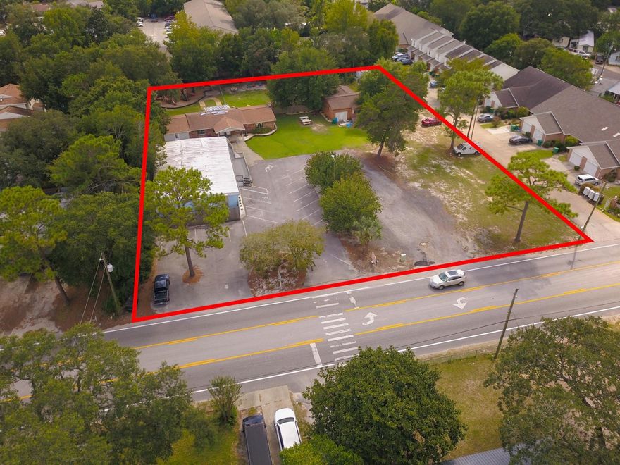 This Commercial Property is comprised of 2 adjacent parcels (314/316 Carmel Drive) and includes 3 buildings.  Previously operated as a thriving daycare and could be reopened or rent out the buildings individually.  The property is zoned Suburban Residential with approximately 1.36 acres and density allows for 18 townhomes!!  With very close proximity to Hurlburt Field's back gate, this would be an ideal location for many military families.  Call today for your private showing.