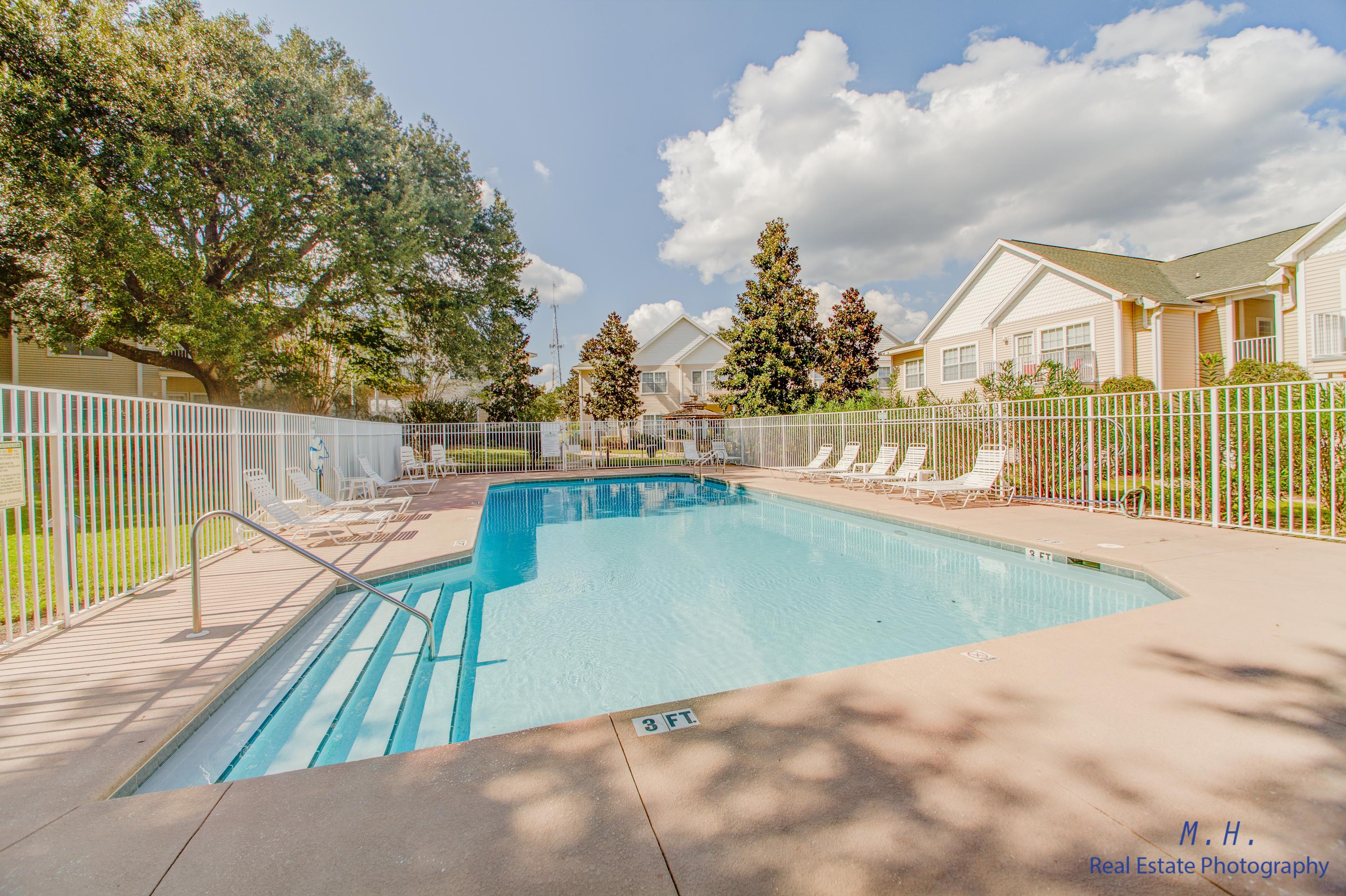 VA APPROVED CONDO FINANCING AVAILABLE. GROUND floor unit with renter in place, perfect for an investor. Tenant can vacate with 30 days' notice. Great location towards the front of the community. Covered back porch off the living room. Call today to schedule your appointment to view this wonderful unit.