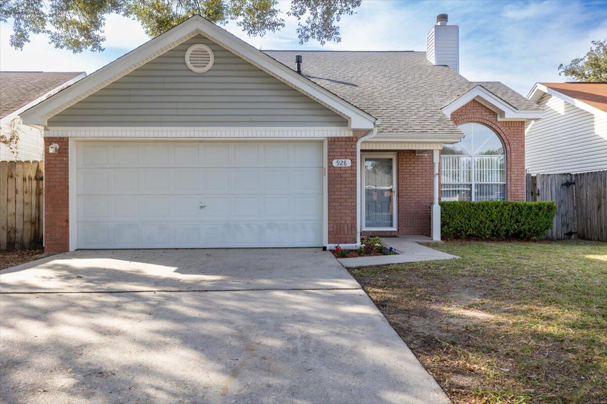 4 Bed / 2.5 Bath Two Story Stunner in Fort Walton BeachLight abounds in the cathedral ceilings of the entryway and living room from large paned windows in the front of the home, topped with an elliptical sunburst, mirrored by light through the sliding doors at the rear of the home.  The grandeur of the living room is made intimate by a fireplace with diamond-pattern tile surround and ornate wood molding and mantle.  Through a large arched threshold, the dining area has sliding door access to the privacy fenced backyard.  Down the hall off the dining room is the guest half bath and master bedroom featuring a bathroom with a walk-in closet and private access to the backyard through a sliding door.