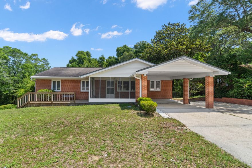A classic corner lot home in Valparaiso Florida.  Just a few miles from Eglin AFB with easy access to Duke Field, 7th Special Forces Group and Hurlburt Field.  This brick home features a front screened porch, an open deck, and a covered carport. The home has vinyl windows with hurricane shutters for lower insurance rates.  Original hardwood floors are still in great condition. The first bedroom has a custom Murphy bed plus a closet, perfect for guests but also makes for a great office.  The two additional rooms are light and bright with two windows each, ceiling fans, and hardwood floors. The guest bathroom has a deep cultured marble bath tub/shower, cultured marble vanity with great cabinet storage and tile flooring.