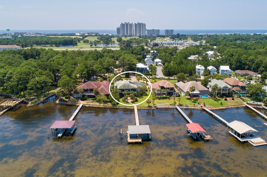 REO Real Estate Owned. One of the most beautiful Bay front residences, built with attention to detail with quality materials, workmanship, craftsmanship and a eye for detail. Enter through iron gates into a large courtyard with an 18x32 heated pool and Jacuzzi and adjoining guest quarters. The studio guest quarters comes complete with a kitchenette and sliding glass doors to the courtyard. This home has everything from the custom cabinetry and doors made from Alder wood to the many tiled terraces, surround systems throughout, plus four ***New*** just installed HVAC units with touch screens and wifi built in thermostats and 2 Rinnai hot water systems. Even the 30x20 three-car garage is heated cooled and finished out. The 12 foot and 14 foot Triple Crown molding is throughout the home. The bay front living room has 24 foot ceiling with three Ernest Hemmingway fans. From the living room is a grand curved staircase leading to the guest rooms and more tiled terraces. One overlooking the pool area and the other overlooking the bay. The kitchen is truly a chef's dream with the finest of appliances, granite counter tops and apron sink. The gorgeous travertine floors provide easy care in this magnificent home. This home is unique to say the least  with 7,160 square feet under roof and situated on 100 feet of bay front. From the moment you enter the gates of this home with its soothing views of the Bay you can feel the very peaceful and calm atmosphere this home provides and incredible views of the bay. Entertain friends and cook out at the summer kitchen complete with a Decor 4 burner rotisserie gas grill and sink and granite counter tops. Dock also includes a boathouse with boatlifts for all the water toys! Call us to view this beautiful bay home at 420-B Bayshore Dr today.