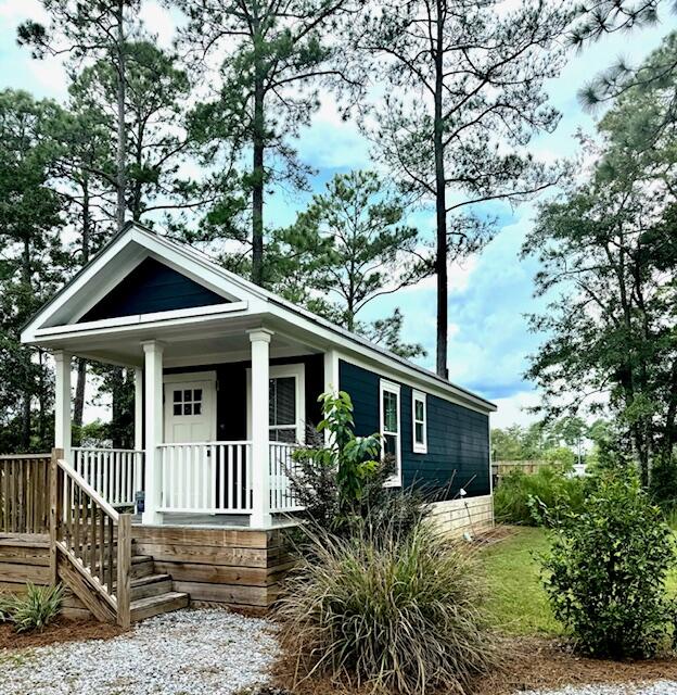 Welcome to the tiny house revolution! Perfectly placed on over half an acre this gem is ready for enjoy the simple life. Just moments away from the Beaches of S. Walton, Freeports newest shopping & dining establishments, Publix, 850 Piza Co, T's Catch Fish Market, Otto's Car Wash, just to mention a few. This one bedroom, full bath, kitchen with appliances and stack washer dryer, along with a living area provide all you need. Enjoy your morning coffee on the covered front porch and your evenings around the firepit. Also, minutes from the house is Grady Brown Park with its play area, picnic tables, grills, restrooms, sandy beach and boat ramp to the Choctawhatchee Bay. No HOA and a RV hookup on the property for guest or a tenant