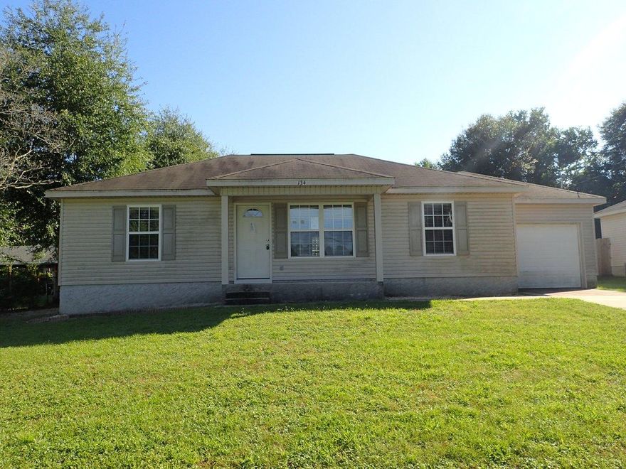 This Fannie Mae HomePath REO property is cute as a button! Over 1100sf, this 3 bedroom 2 bath split bedroom designed home has vinyl siding, privacy fenced back yard and single car garage. A large deck is just off the back of the home and is perfectly designed to accommodate a large hot tub. Inside, this home has wall to wall carpet and vinyl. Vaulted ceilings in the living room which opens to the dining and then kitchen area. Home will easily qualify for conventional financing and may need some work for others. Call today to see this home!